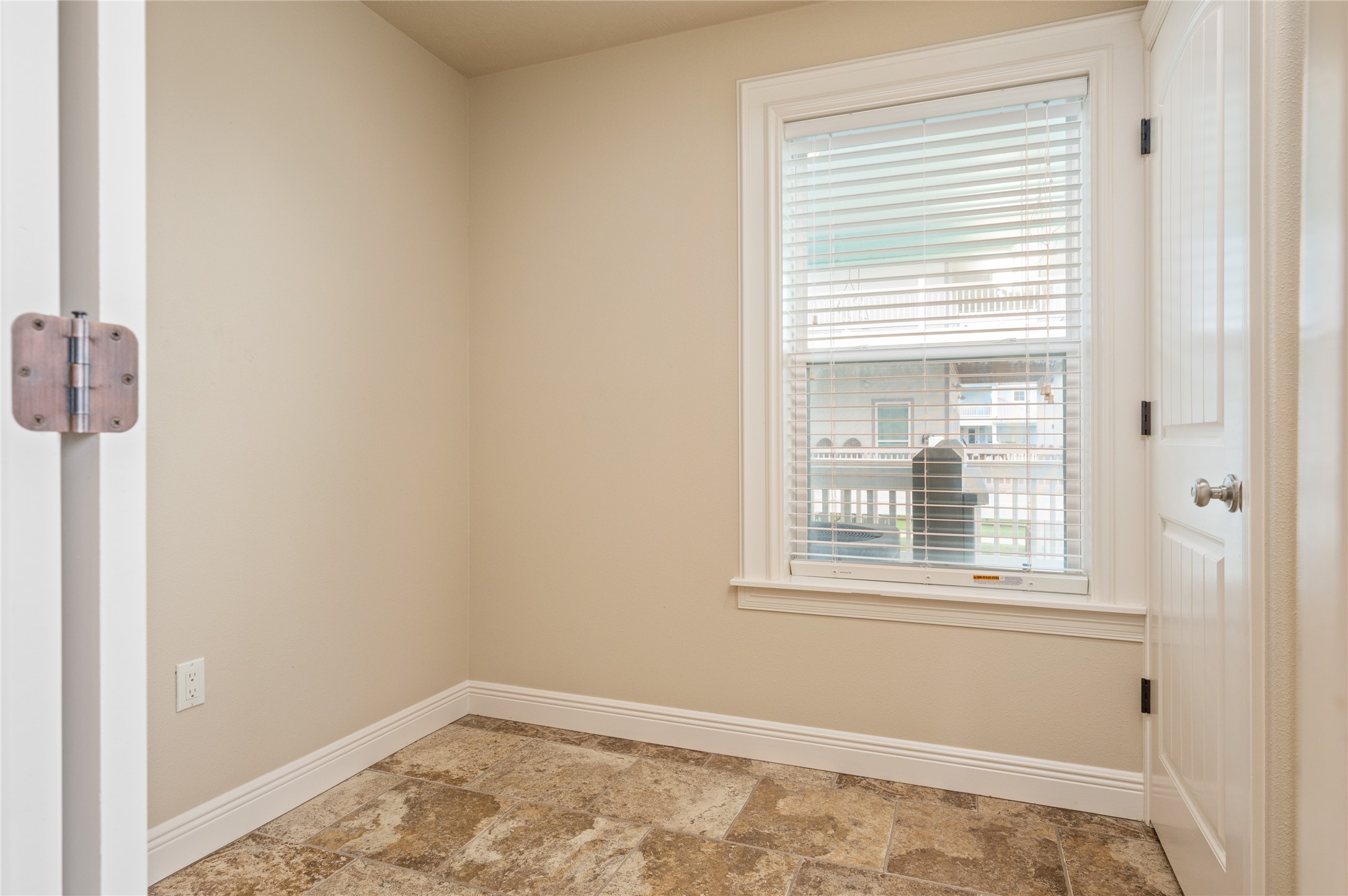 Keep everyday essentials organized in this convenient nook, with built-in cabinetry and a window bringing in natural light.