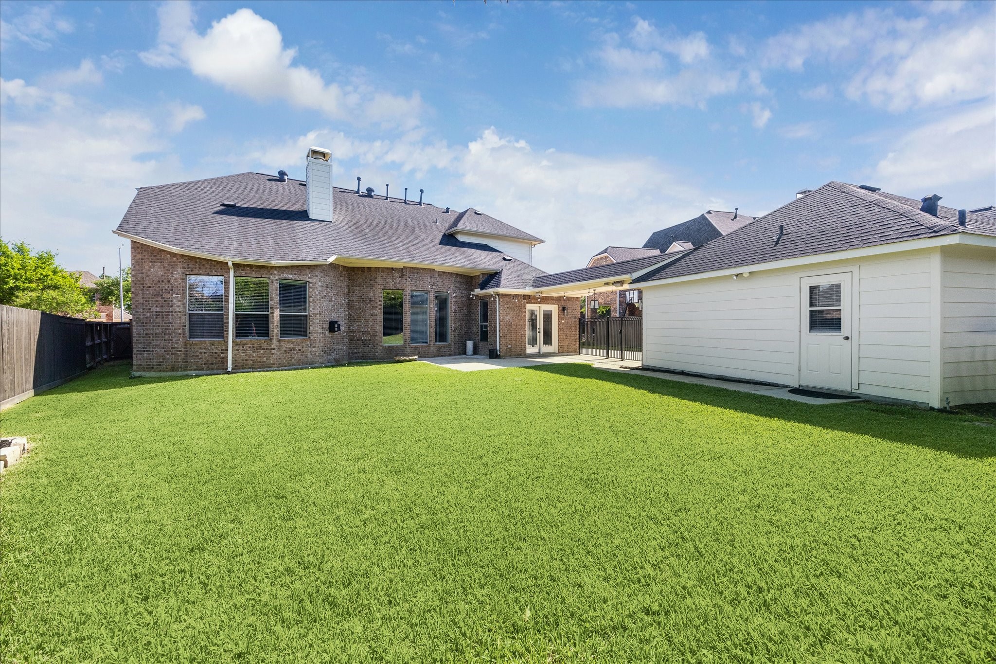Oversize fully gated backyard w convenient half bath off garage