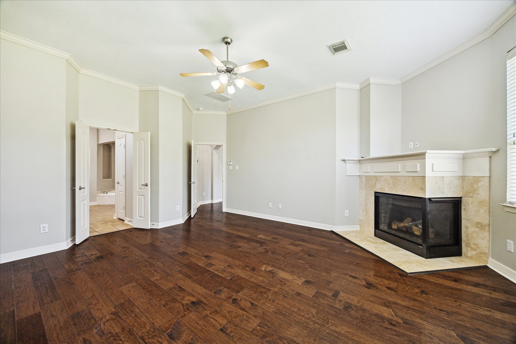 Neutral colors throughout, crown molding & hardwood floors throughout
