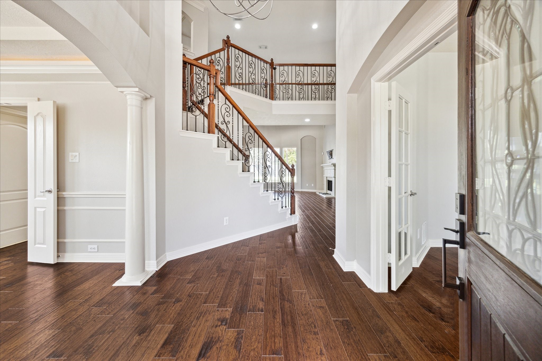 Wrought iron staircase & hardwood floors throughout Wrought iron staircase & hardwood floors throughout