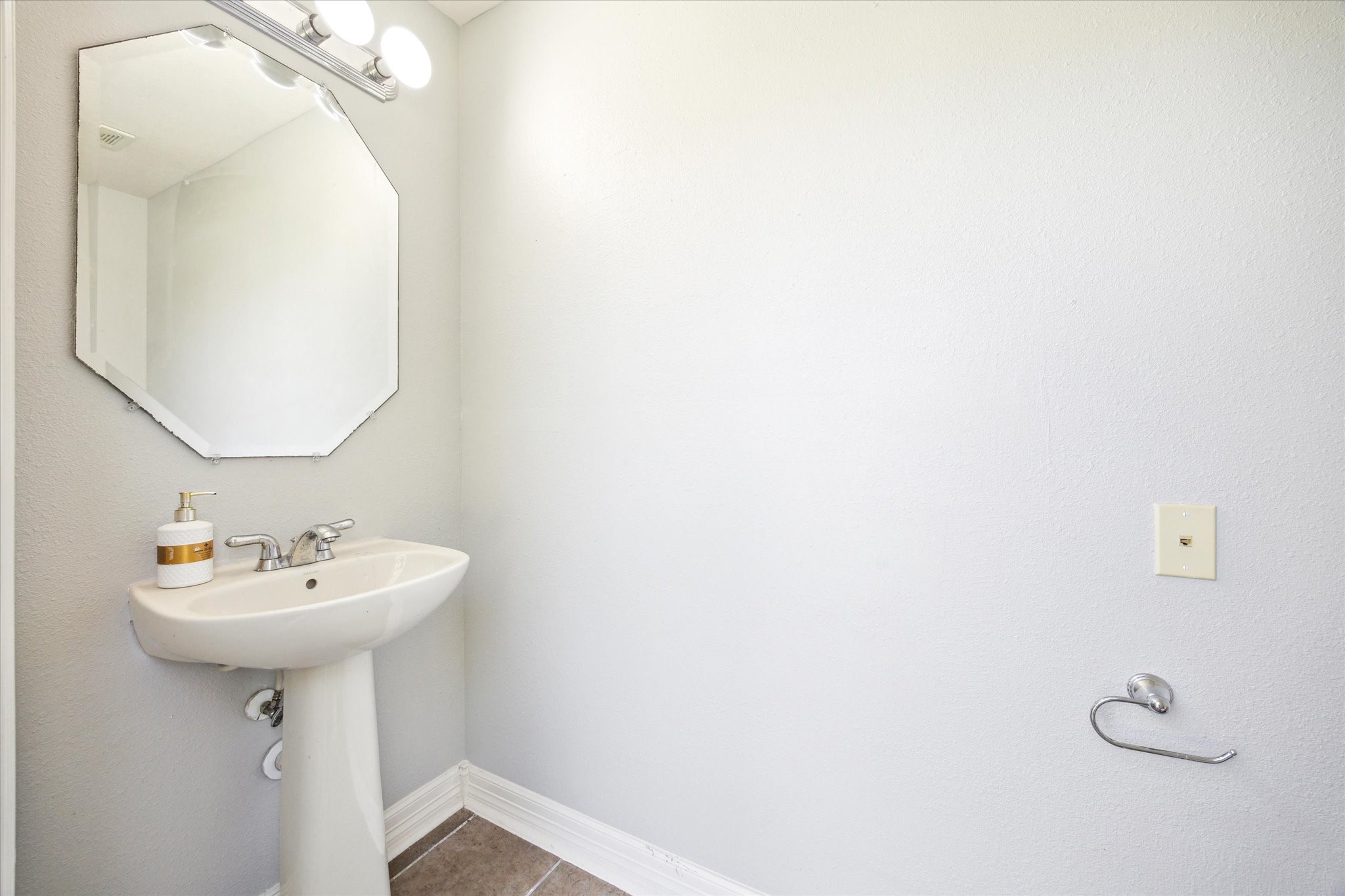 Convenient second powder bath w pedestal sink next to backyard