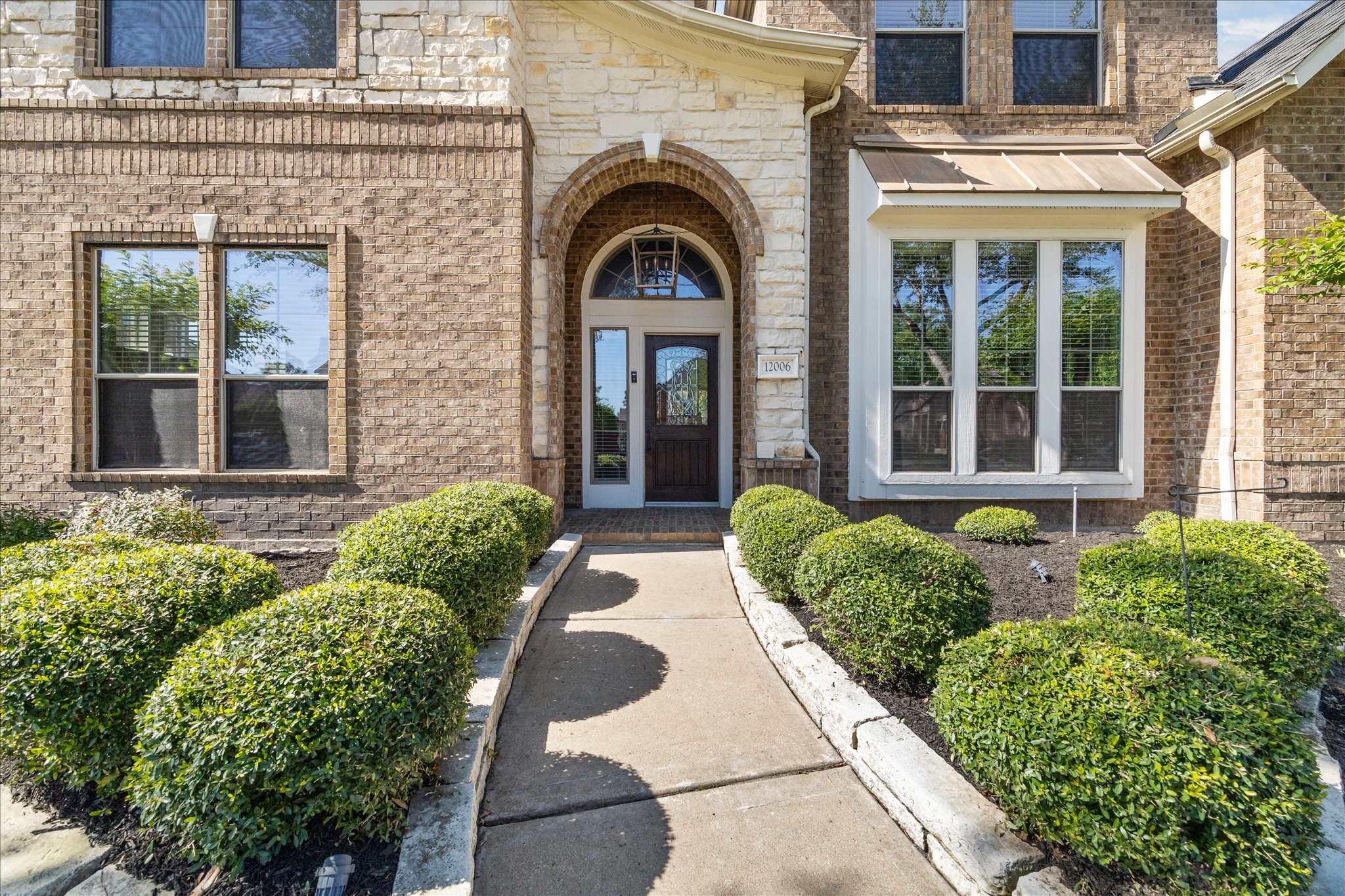 Covered front porch & mahogany front door Covered front porch & mahogany front door