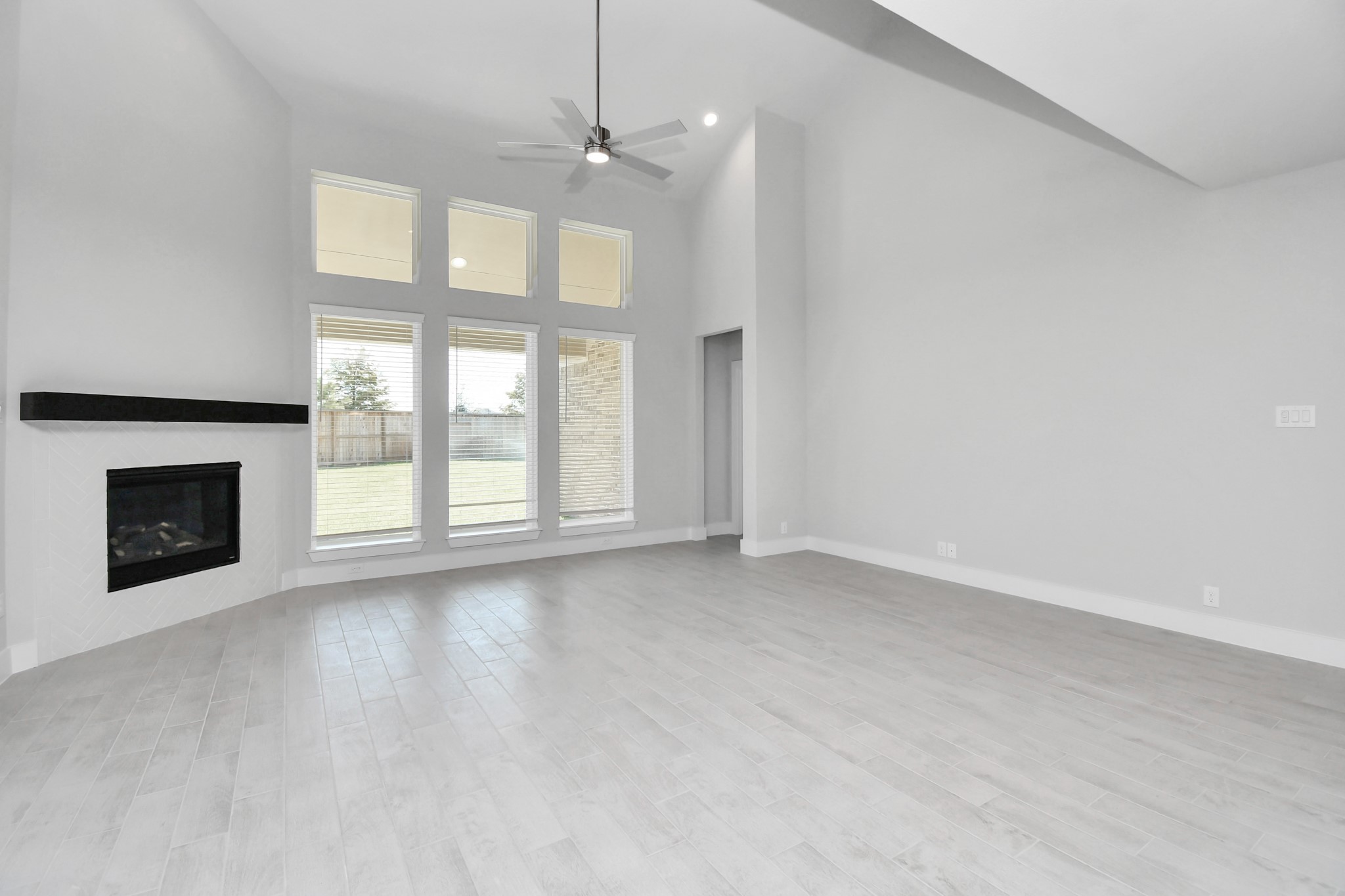Take another glimpse into the heart of the home with this additional view of the family rooma sprawling space ready to accommodate all your gatherings. Sample photo of completed home with similar floor plan. Actual colors and selections may vary.