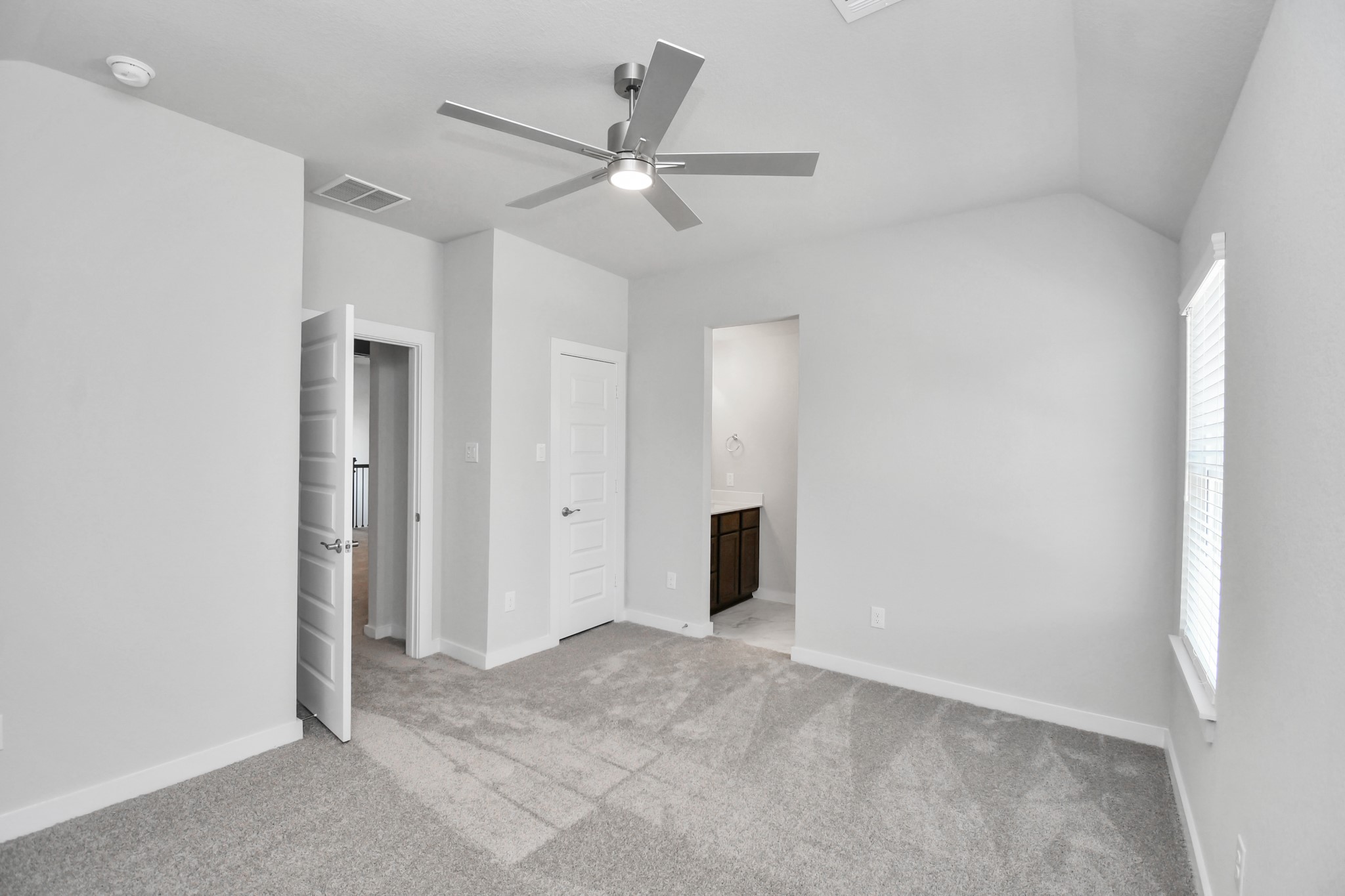 Generously sized secondary bedrooms featuring spacious closets, soft and inviting carpeting underfoot, large windows allowing plenty of natural light, and the added touch of privacy blinds for your personal retreat. Sample photo of completed home with similar floor plan. Actual colors and selections may vary.