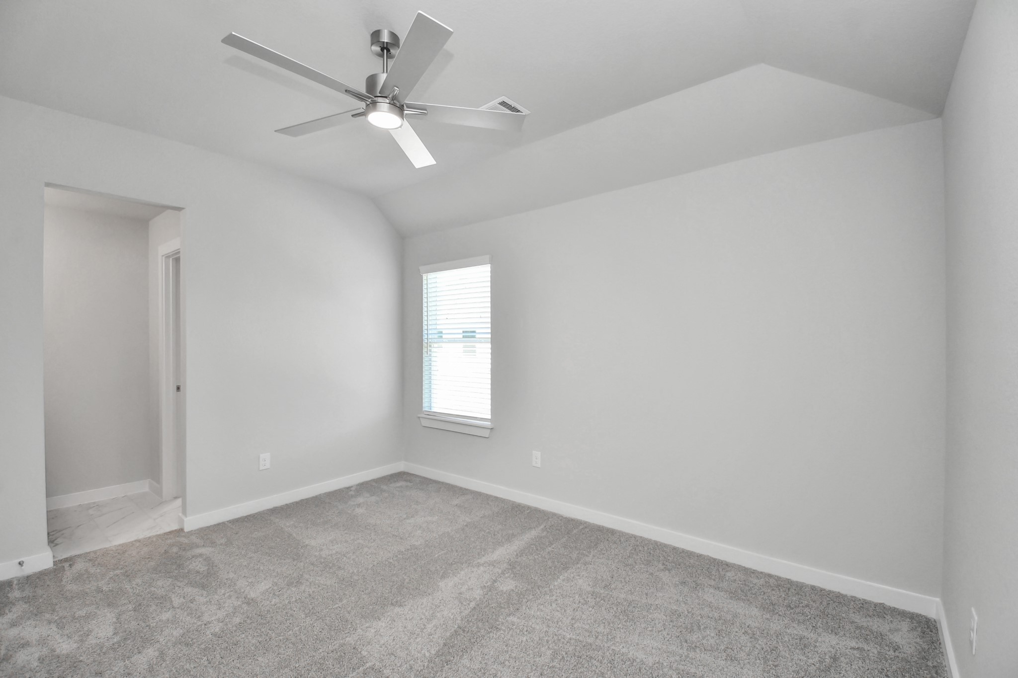 Generously sized secondary bedrooms featuring spacious closets, soft and inviting carpeting underfoot, large windows allowing plenty of natural light, and the added touch of privacy blinds for your personal retreat. Sample photo of completed home with similar floor plan. Actual colors and selections may vary.