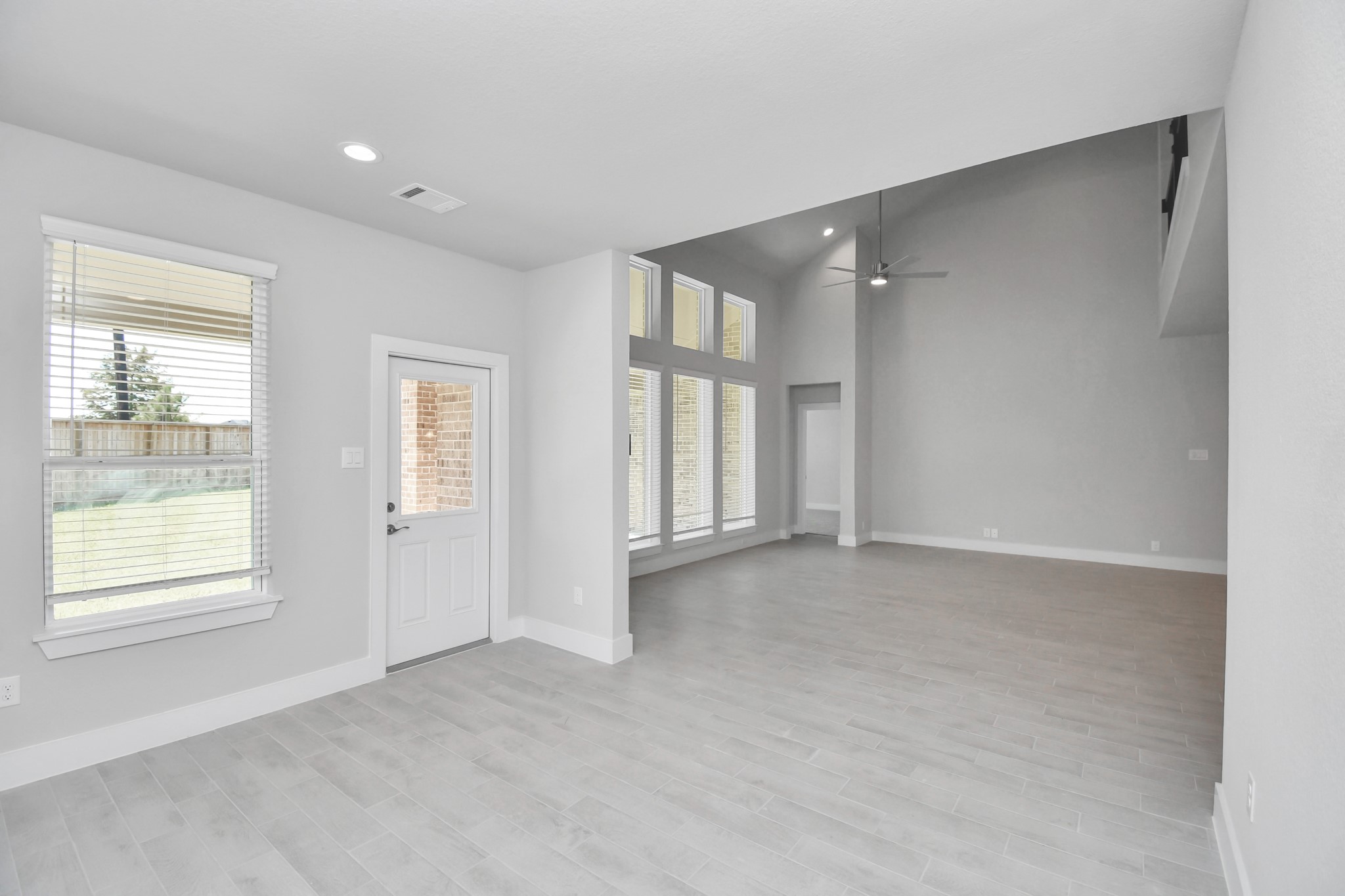 Make memories gathered around the table with your family and friends! This spacious dining room features elegant flooring, custom paint, and adjacent to family room and kitchen for open concept feel. Sample photo of completed home with similar floor plan. Actual colors and selections may vary.
