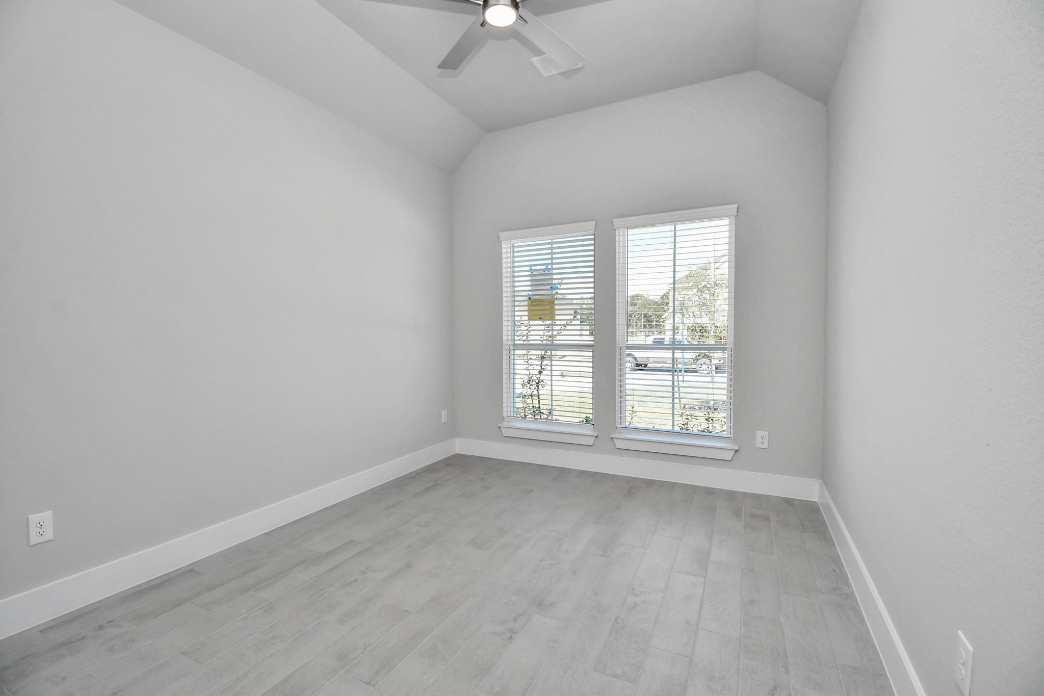 Step into this inviting home office, adorned with premium tile flooring that infuses a sense of freshness and comfort into the workspace. Bask in the natural light pouring through the window, fostering an inspiring environment ideal for productivity and focused work. Sample photo of completed home with similar floor plan. Actual colors and selections may vary.