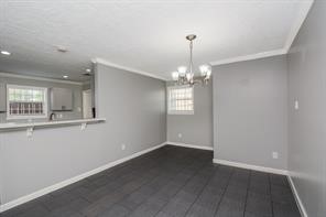 Open concept Dining area has its own storage closet