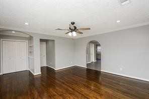 Spacious living room with entry foyer and built in shelves
