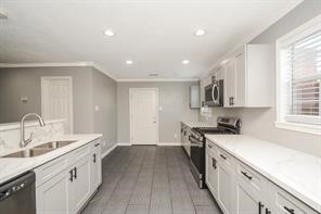 Chefs kitchen with lots of counter and storage space.