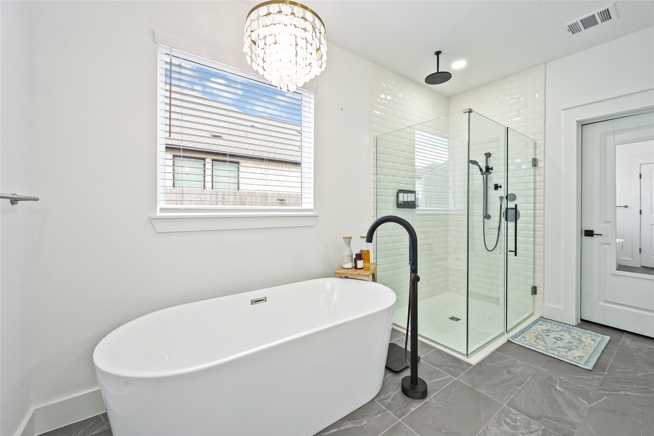 stunning spa-inspired primary bathroom, spacious glass-enclosed walk-in shower