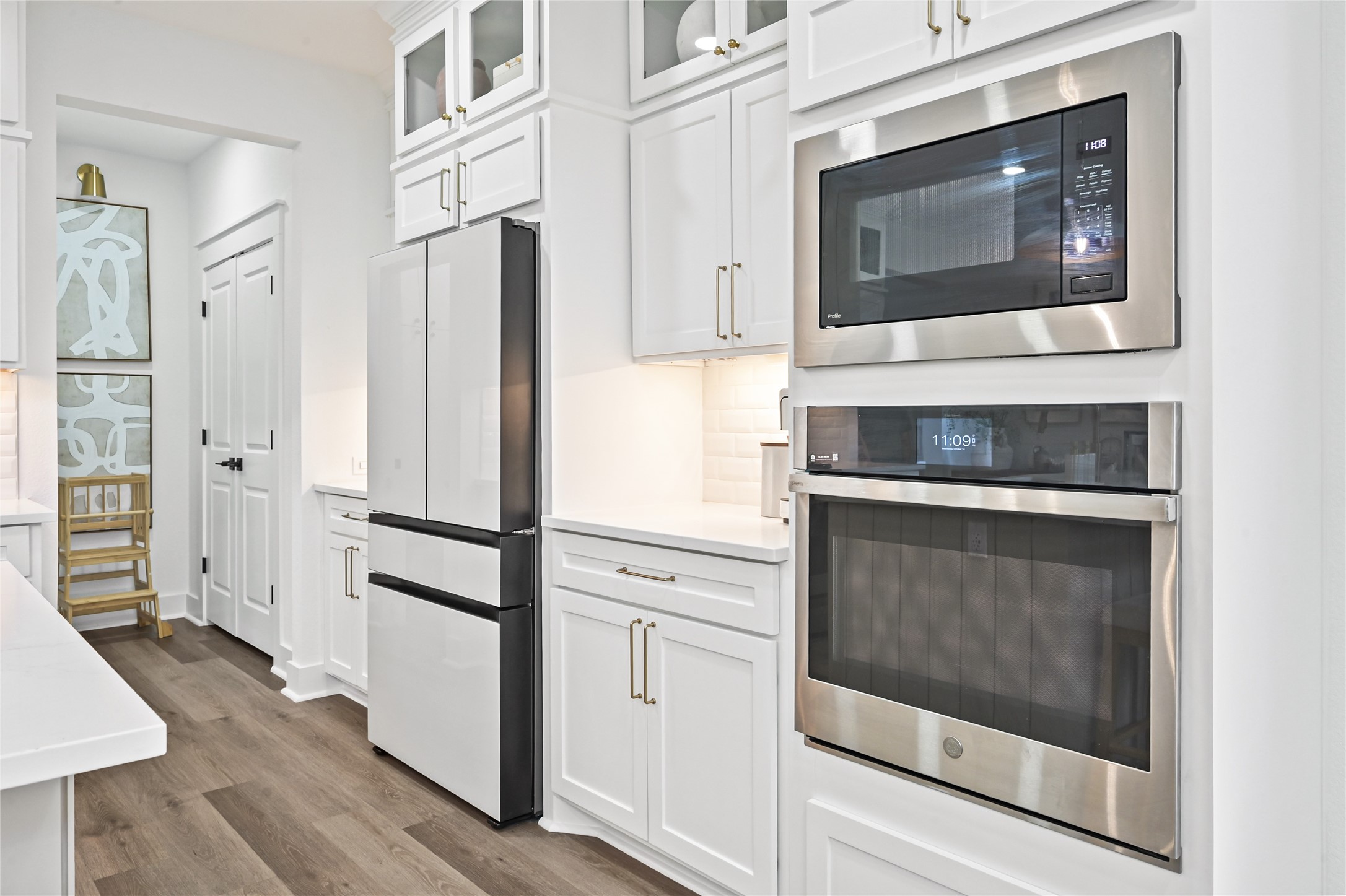 Sleek stainless steel double wall oven and a built-in microwave