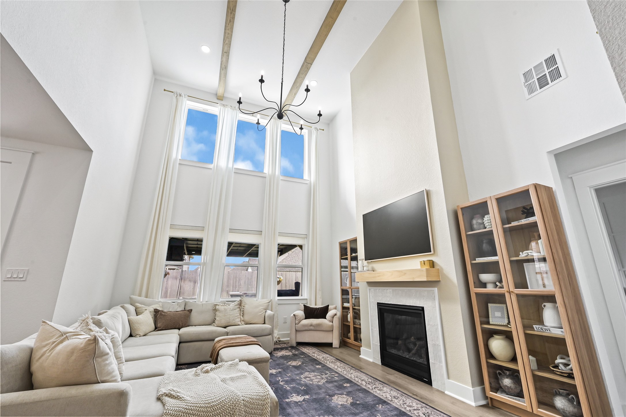 Soaring ceilings, expansive windows, and an abundance of natural light