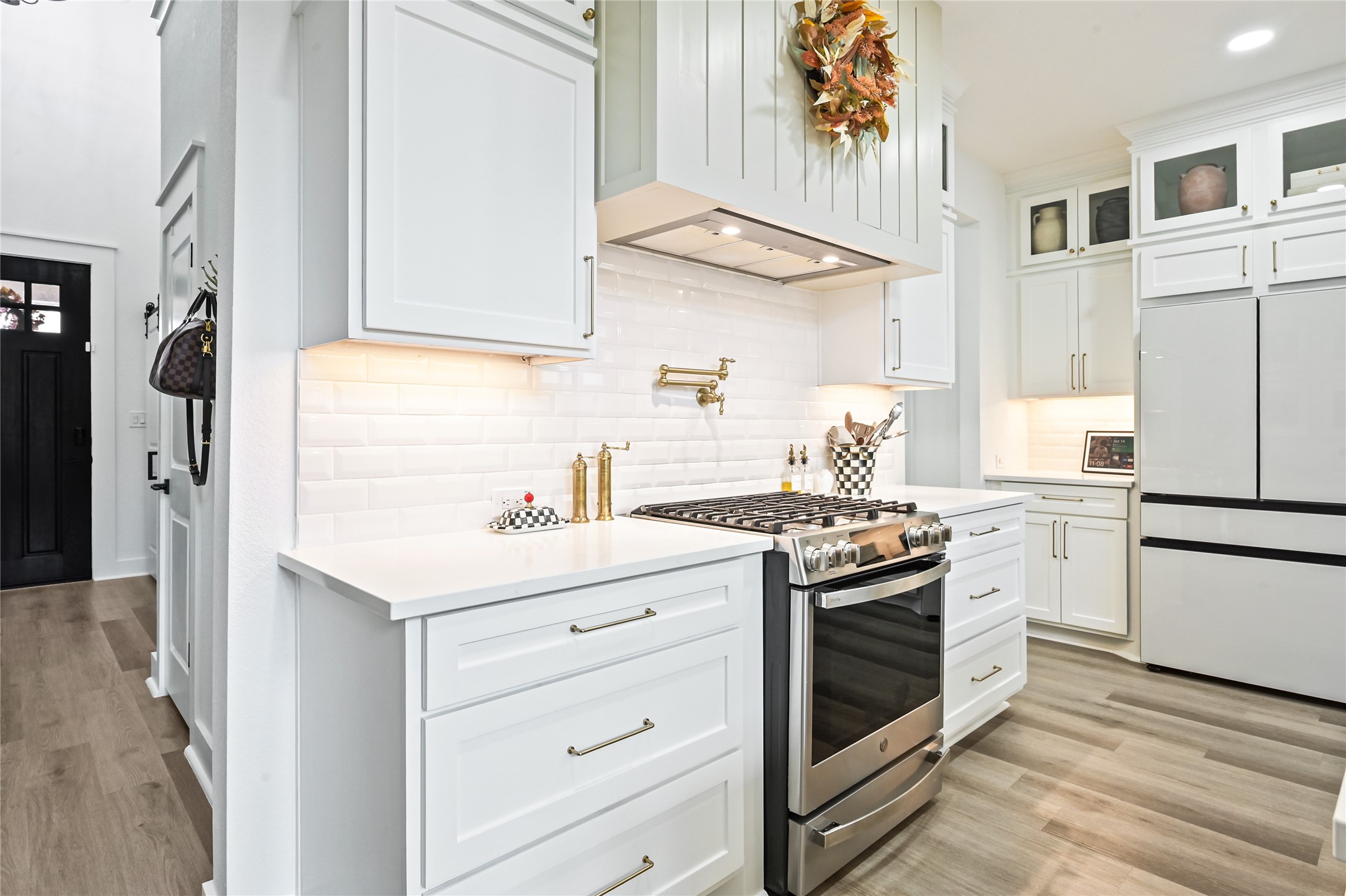 Sleek stainless steel gas range with a coordinating vent hood
