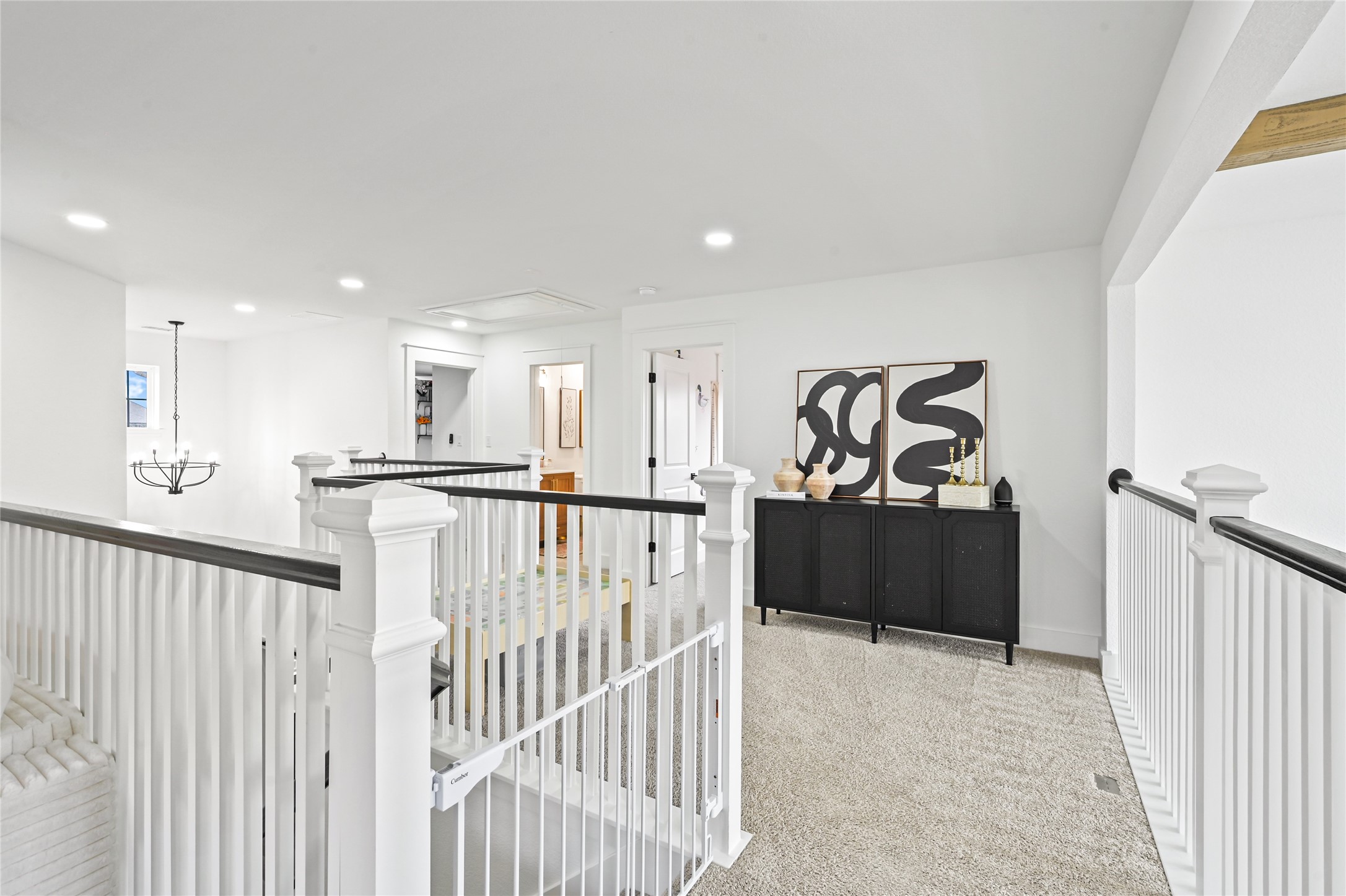 Upstairs loft and second-floor landing offers an elegant combination of open space, architectural charm, and modern sophistication
