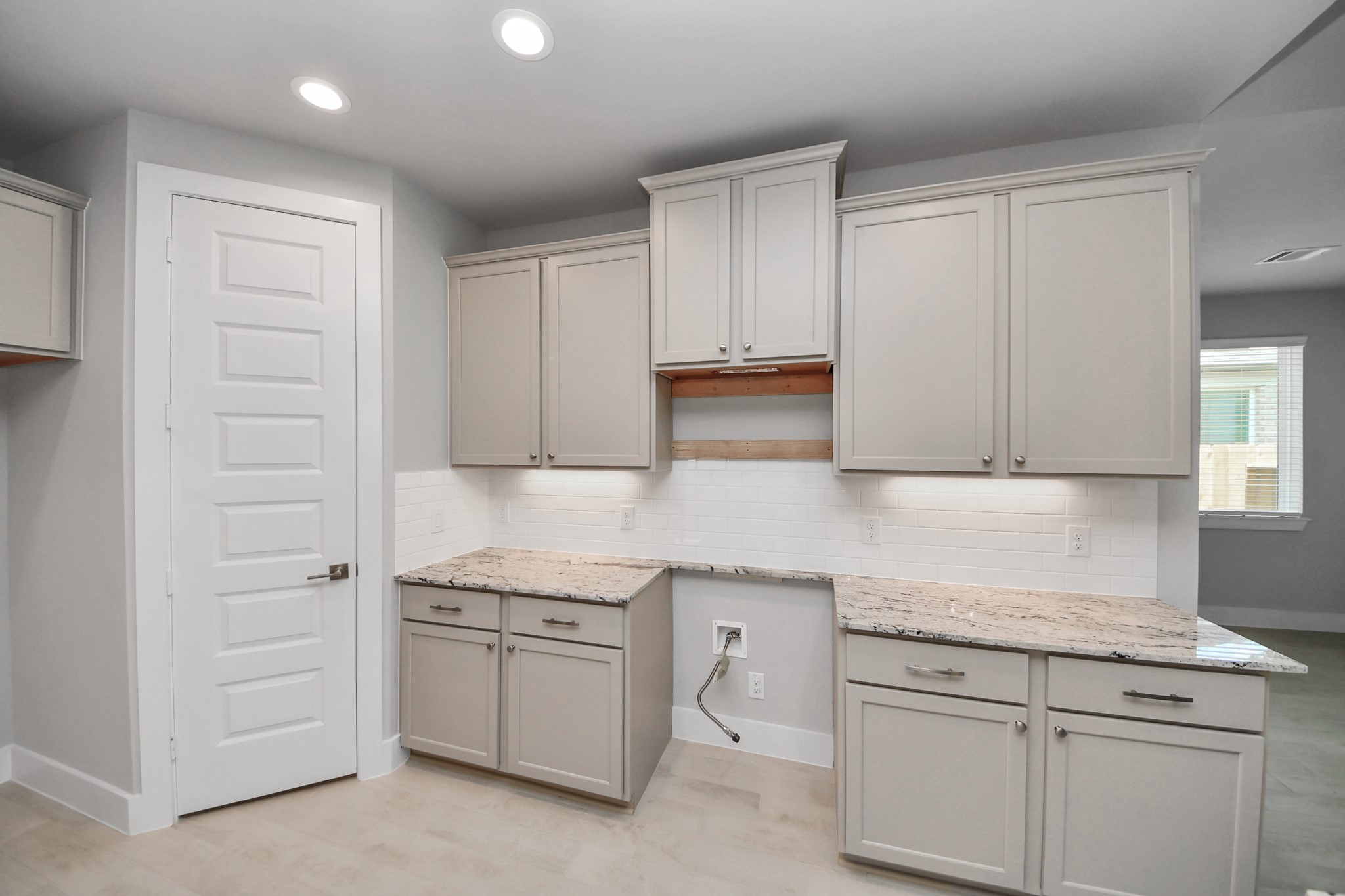 The open concept effortlessly connects the kitchen to the expansive family room, forming a perfect hub for gatherings. This seamless flow creates an inviting space where cooking and socializing come together harmoniously. Sample photo of completed home with similar floor plan. Actual colors and selections may vary.