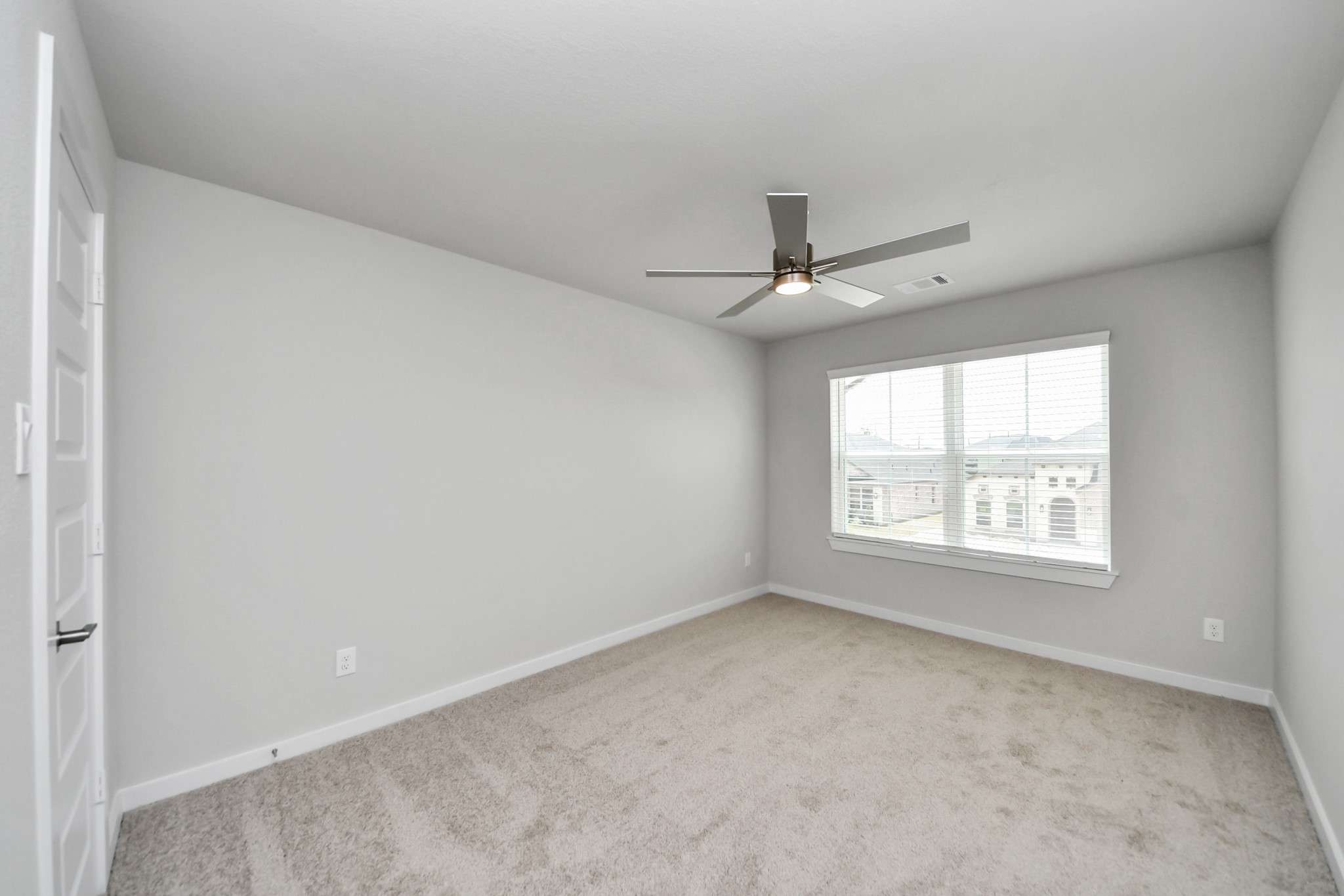 Generously sized secondary bedrooms featuring spacious closets, soft and inviting carpeting underfoot, large windows allowing plenty of natural light, and the added touch of privacy blinds for your personal retreat. Sample photo of completed home with similar floor plan. Actual colors and selections may vary.