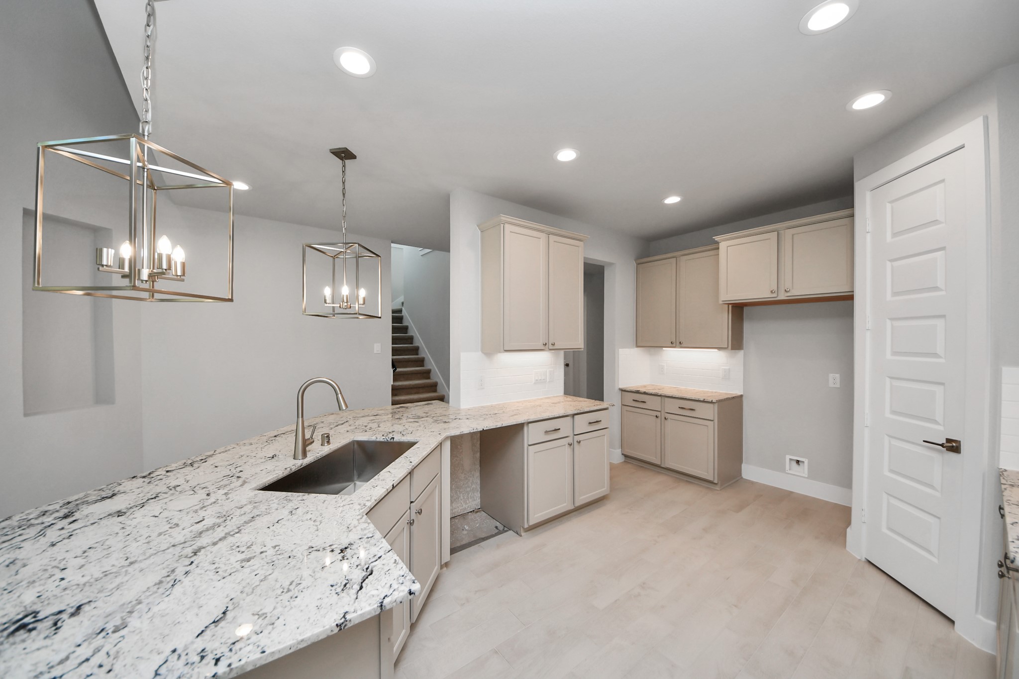 The extended counter area adds both practicality and style, making meal preparation a breeze. Every detail is thoughtfully designed to enhance the kitchen's functionality and aesthetic appeal. Sample photo of completed home with similar floor plan. Actual colors and selections may vary.