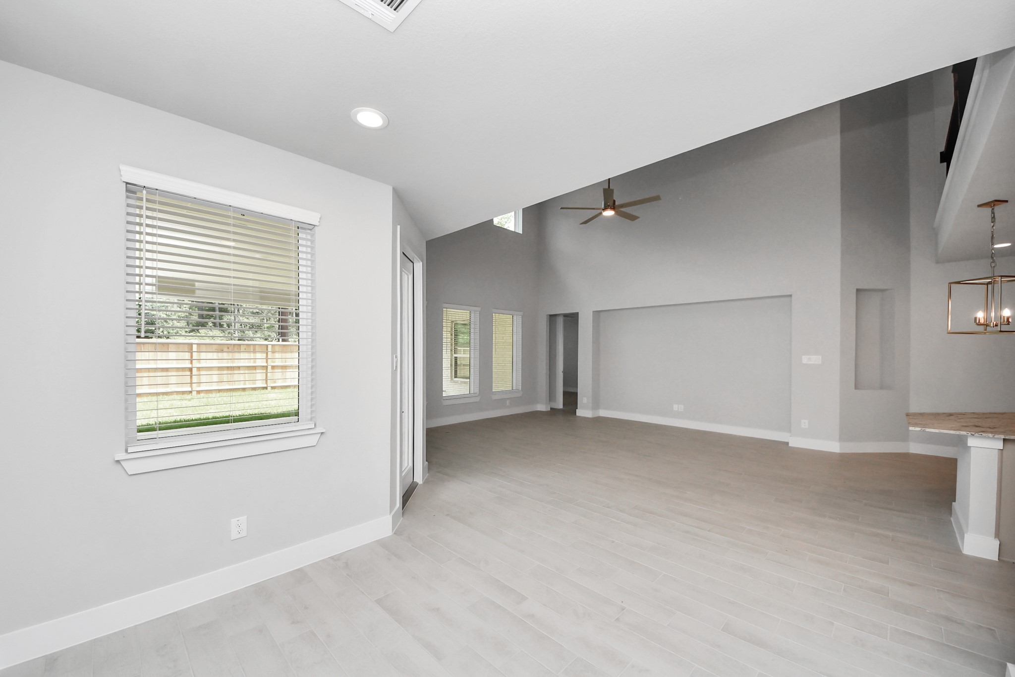 Enjoy breakfast with ease in the connected and cozy breakfast area, seamlessly integrated with the kitchen for utmost convenience. Step through the back door for a breath of fresh air onto the covered patio, extending your living space to the outdoors. Sample photo of completed home with similar floor plan. Actual colors and selections may vary.