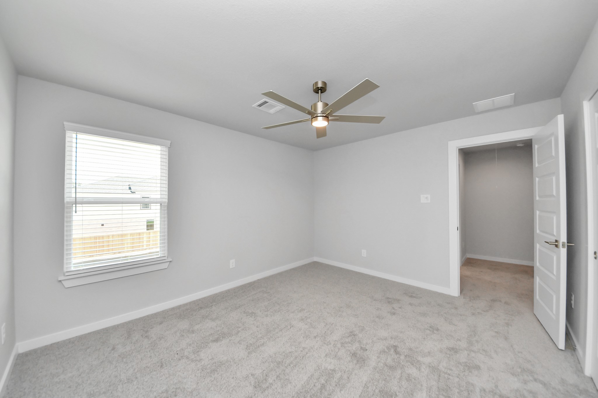 Generously sized secondary bedrooms featuring spacious closets, soft and inviting carpeting underfoot, large windows allowing plenty of natural light, and the added touch of privacy blinds for your personal retreat. Sample photo of completed home with similar floor plan. Actual colors and selections may vary.
