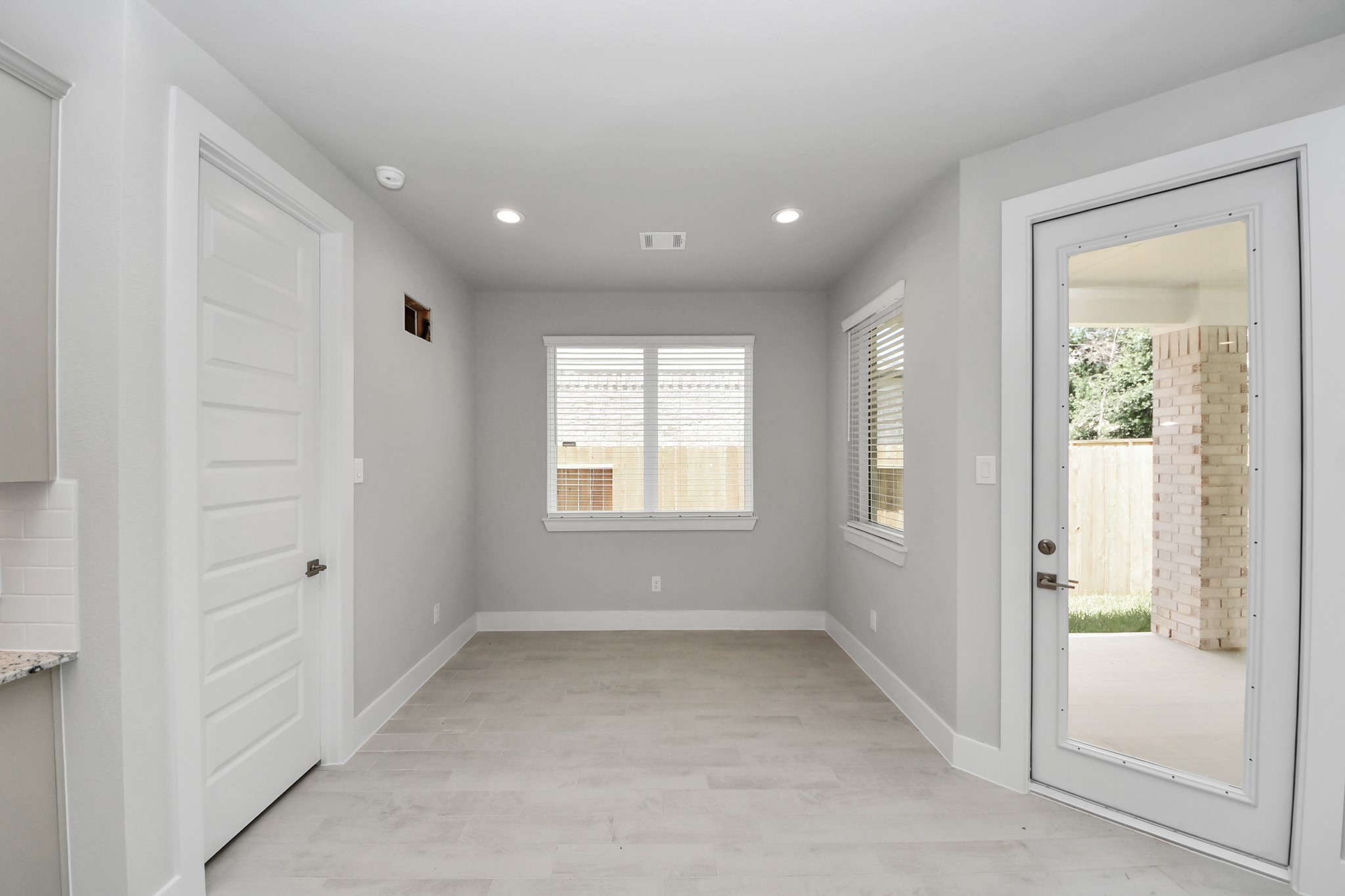 Enjoy breakfast with ease in the connected and cozy breakfast area, seamlessly integrated with the kitchen for utmost convenience. Step through the back door for a breath of fresh air onto the covered patio, extending your living space to the outdoors. Sample photo of completed home with similar floor plan. Actual colors and selections may vary.