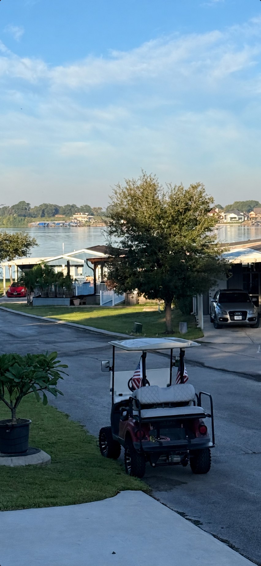 Enjoy views of Lake Conroe from the homes front porcha relaxing backdrop for morning coffee or unwinding at the end of the day.