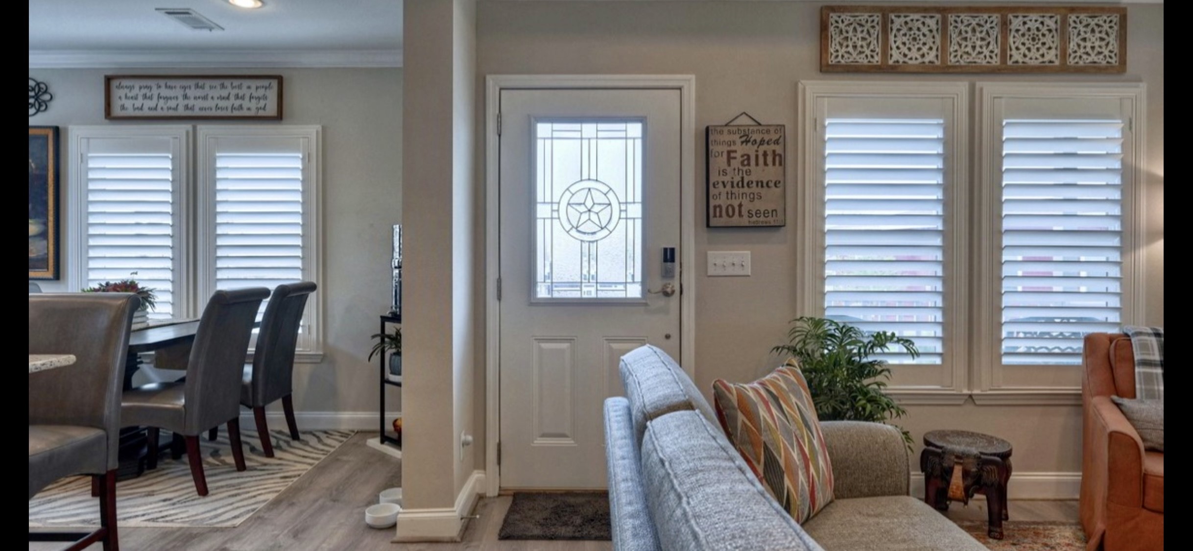 Open living/dining area features upgraded laminate flooring, windows with shutters & easy access to the front entry.