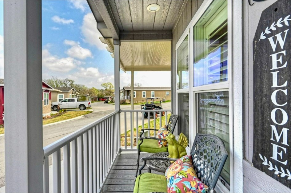 Relax on the covered front porch with room for seatinga welcoming spot to enjoy morning coffee or unwind outdoors.