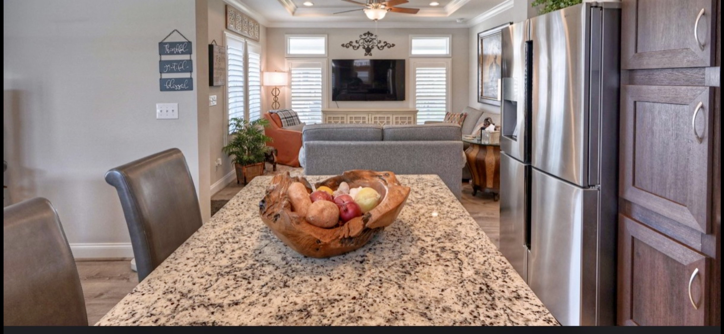 Generous breakfast bar provides casual seating & additional prep space while keeping the kitchen connected to the living area.