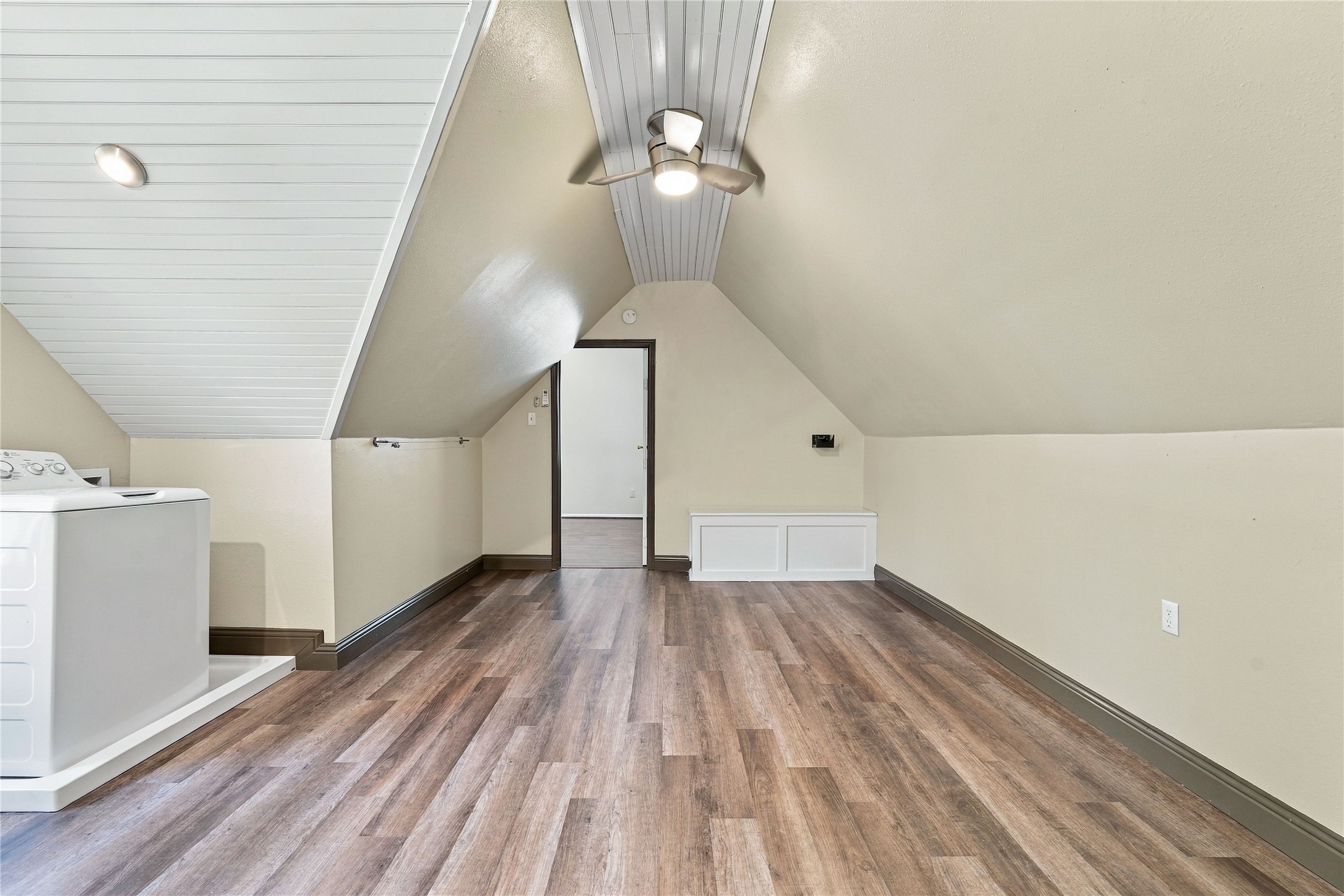 Additional view of the upstairs laundry/bonus room, offering flexible space for storage, hobbies, or other uses.