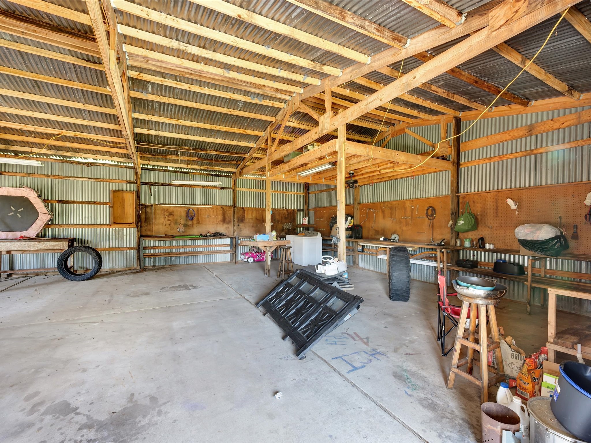 Spacious workshop featuring ample room for projects and storage.