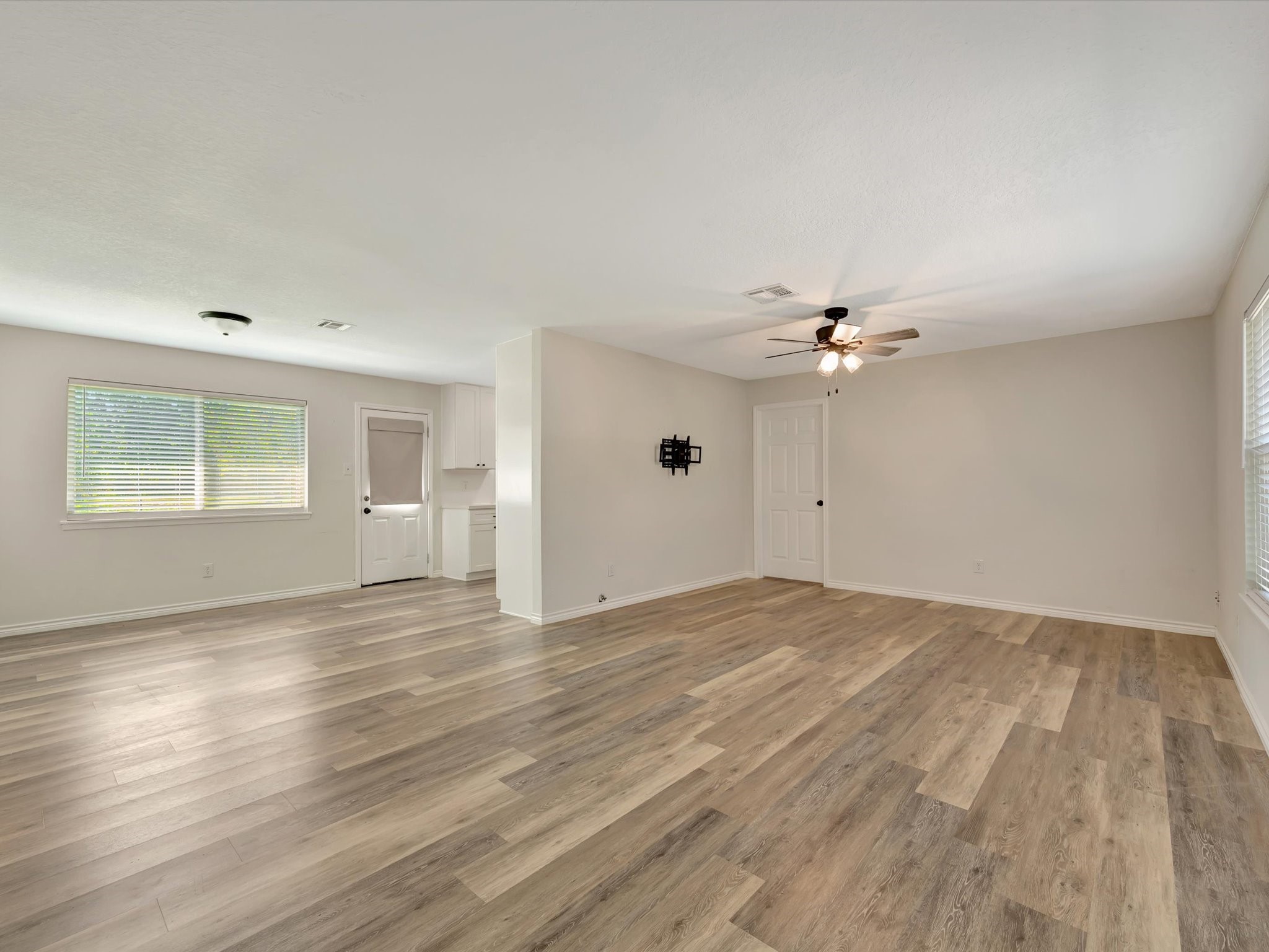 Open-concept living and dining area seamlessly connected to the kitchen.