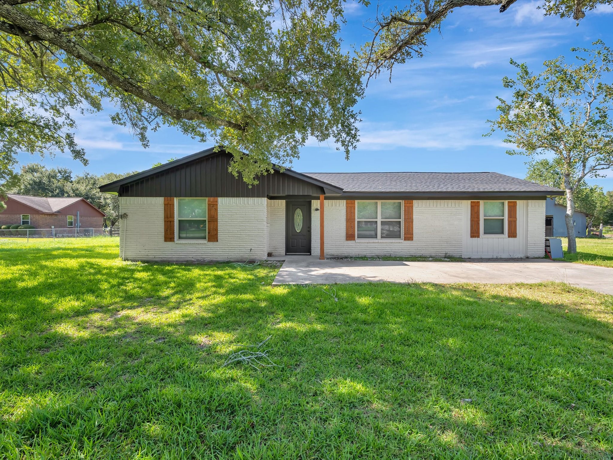 This charming 3-bedroom home is situated on a spacious 1.9-acre lot and features a barn, a versatile shop/garage, and many additional amenities. This charming 3-bedroom home is situated on a spacious 1.9-acre lot and features a barn, a versatile shop/garage, and many additional amenities.