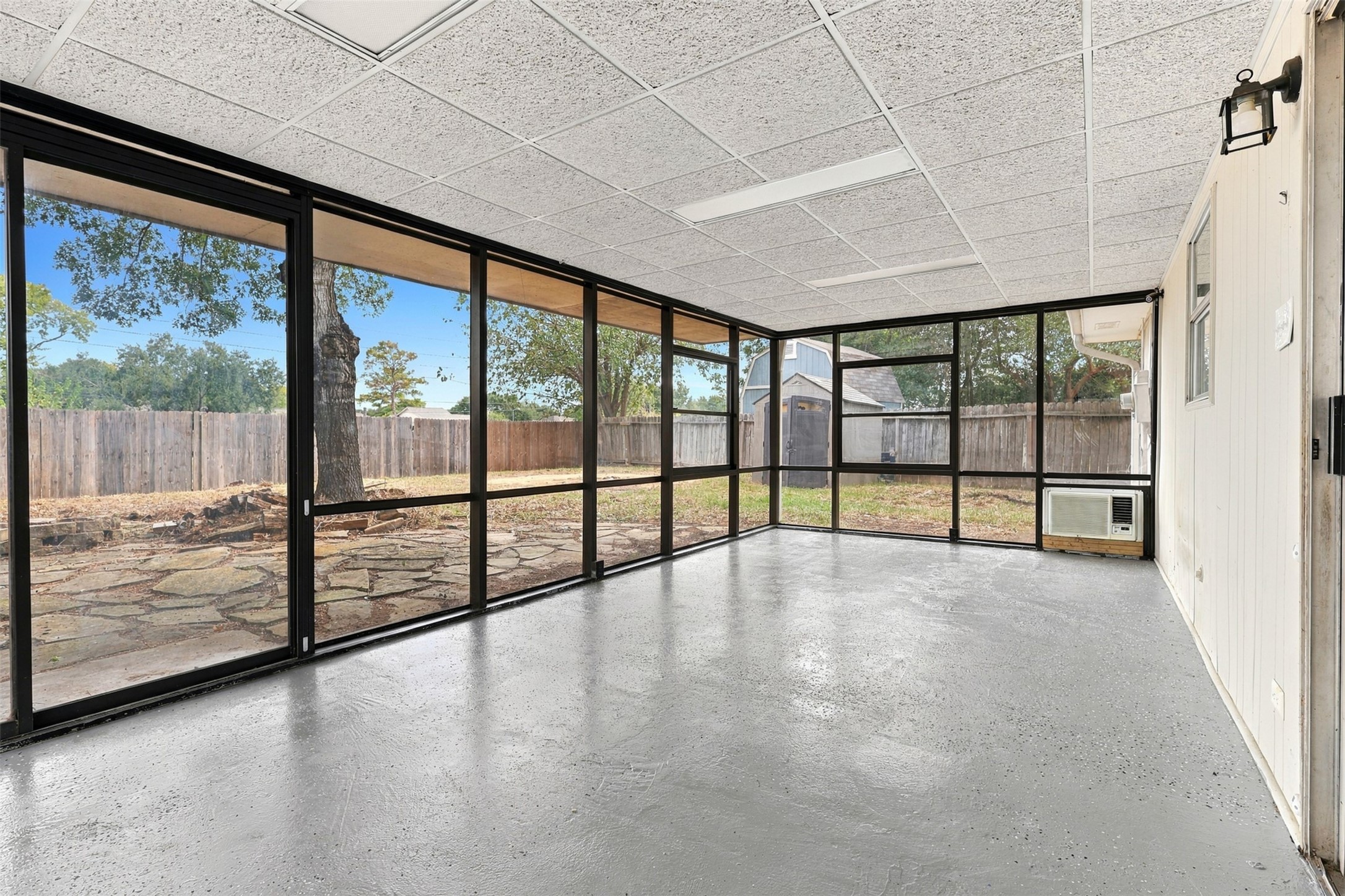 An additional view showcases the sunrooms abundant natural light and versatile space overlooking the backyard.