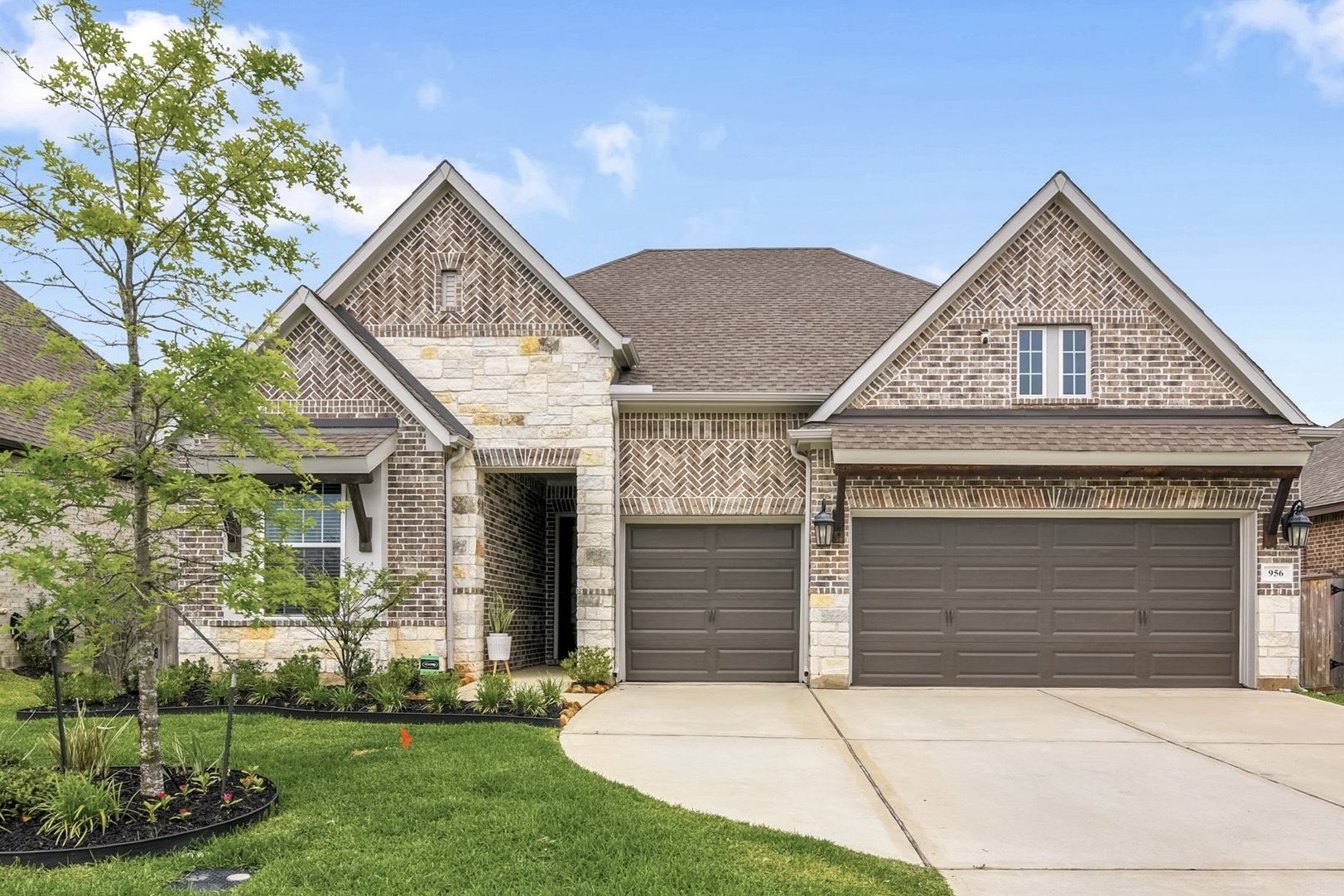 Modern brick home with three-car garage. Spacious driveway and neatly landscaped front yard offering great curb appeal. Modern brick home with three-car garage. Spacious driveway and neatly landscaped front yard offering great curb appeal.