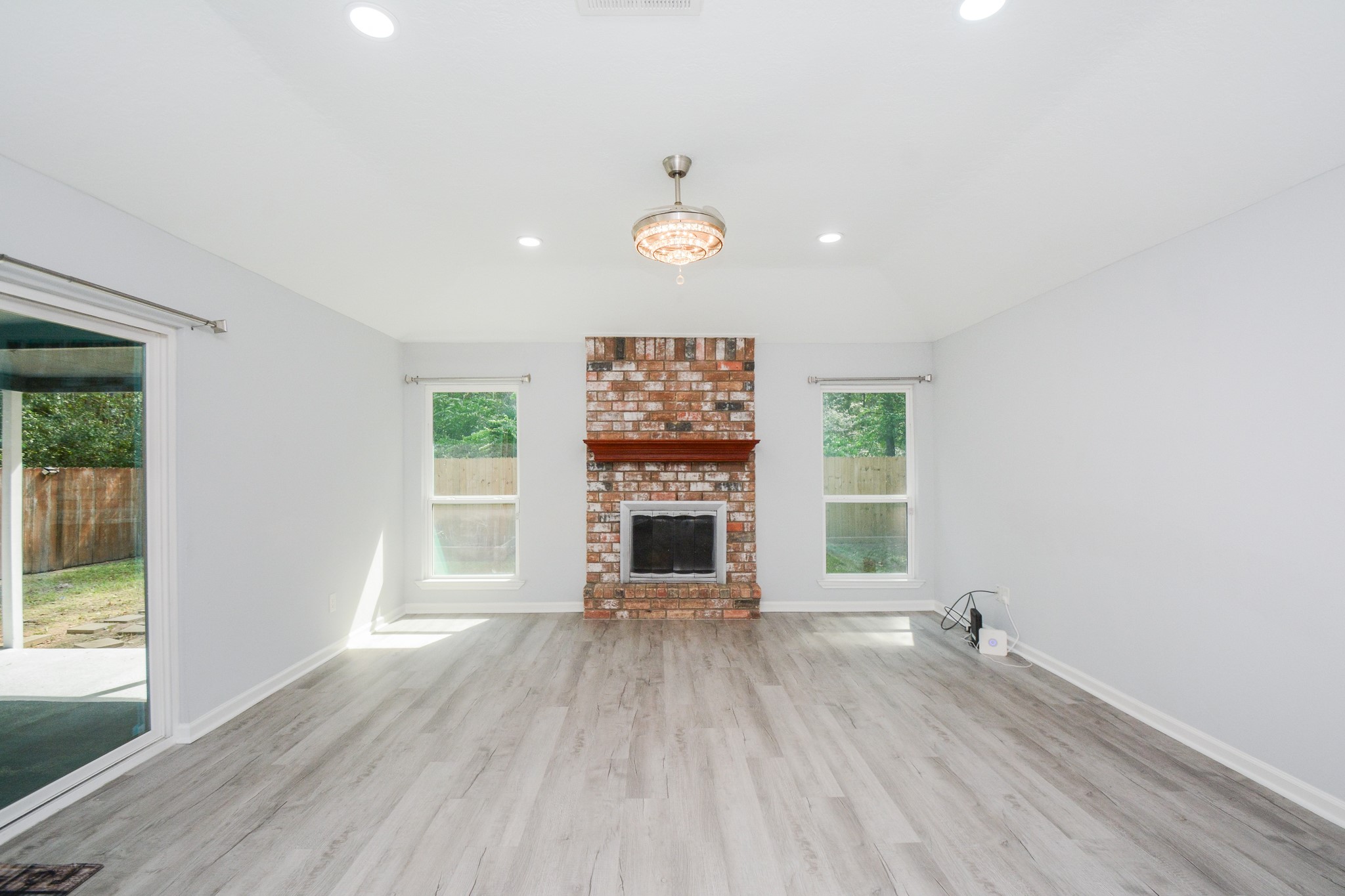 View from the kitchen overlooking the dining & den area. View from the kitchen overlooking the dining & den area.