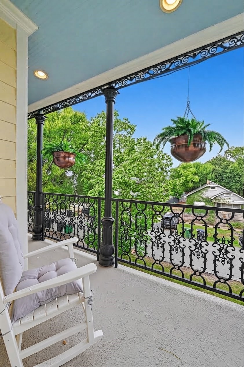 2nd floor covered porch looks out over the front yard and is nice place to enjoy the northern exposure.