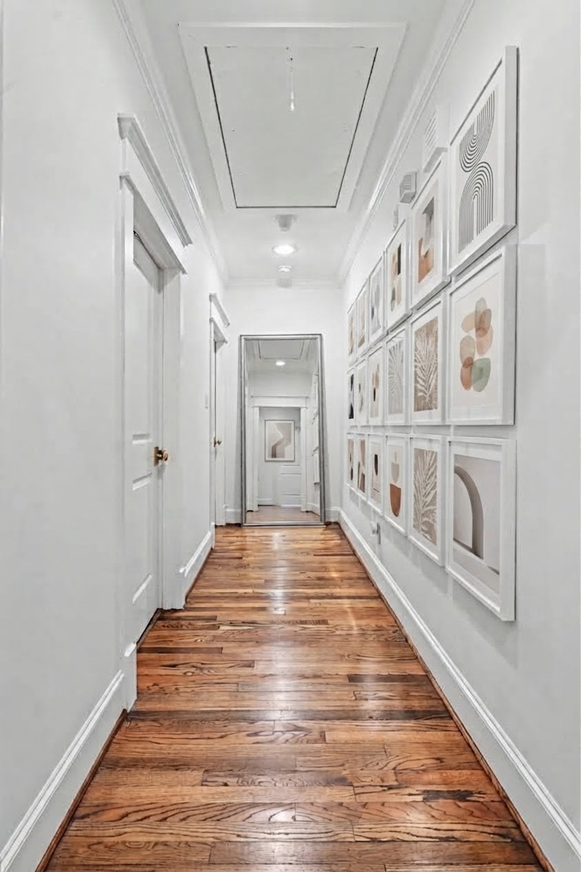 Vestibule which leads to the primary bedroom. Laundry room is to the left.