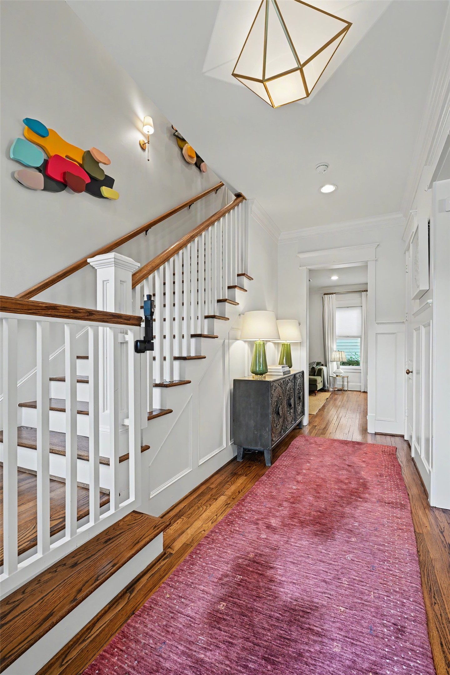 Once inside you are greeted by high ceilings, hardwood floors and stunning fixtures and finishes throughout. Elegant staircase leads up to the 2nd floor with wainscotting to exemplify the craftsmanship of the home. Once inside you are greeted by high ceilings, hardwood floors and stunning fixtures and finishes throughout. Elegant staircase leads up to the 2nd floor with wainscotting to exemplify the craftsmanship of the home.