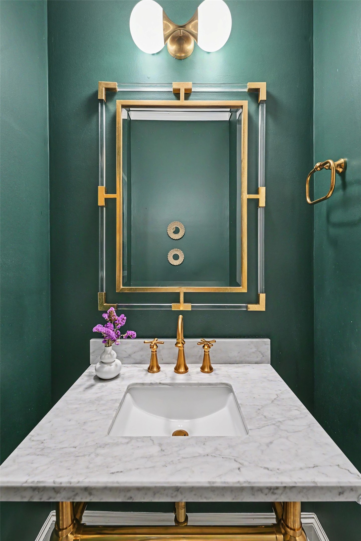 Downstairs powder bathroom is exquisitely designed for guests.