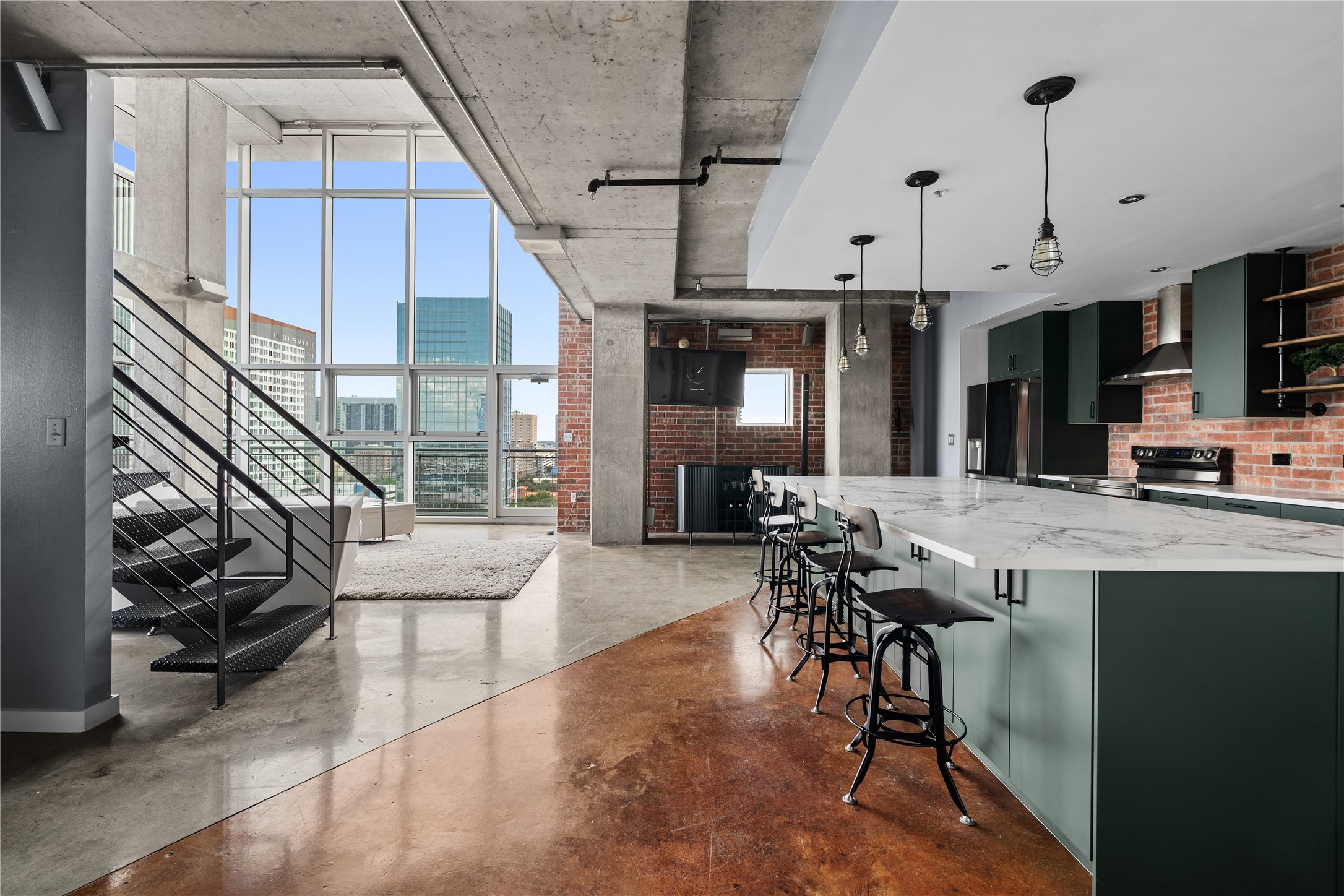 One of the best kept secrets in Rise Lofts as this corner unit underneath the pool grounds gives a penthouse feel without the price tag. The kitchen has been completely remodeled in 11/26 with an expansive quartz island, new cabinetry, floating shelves and brand new state of the art appliances.