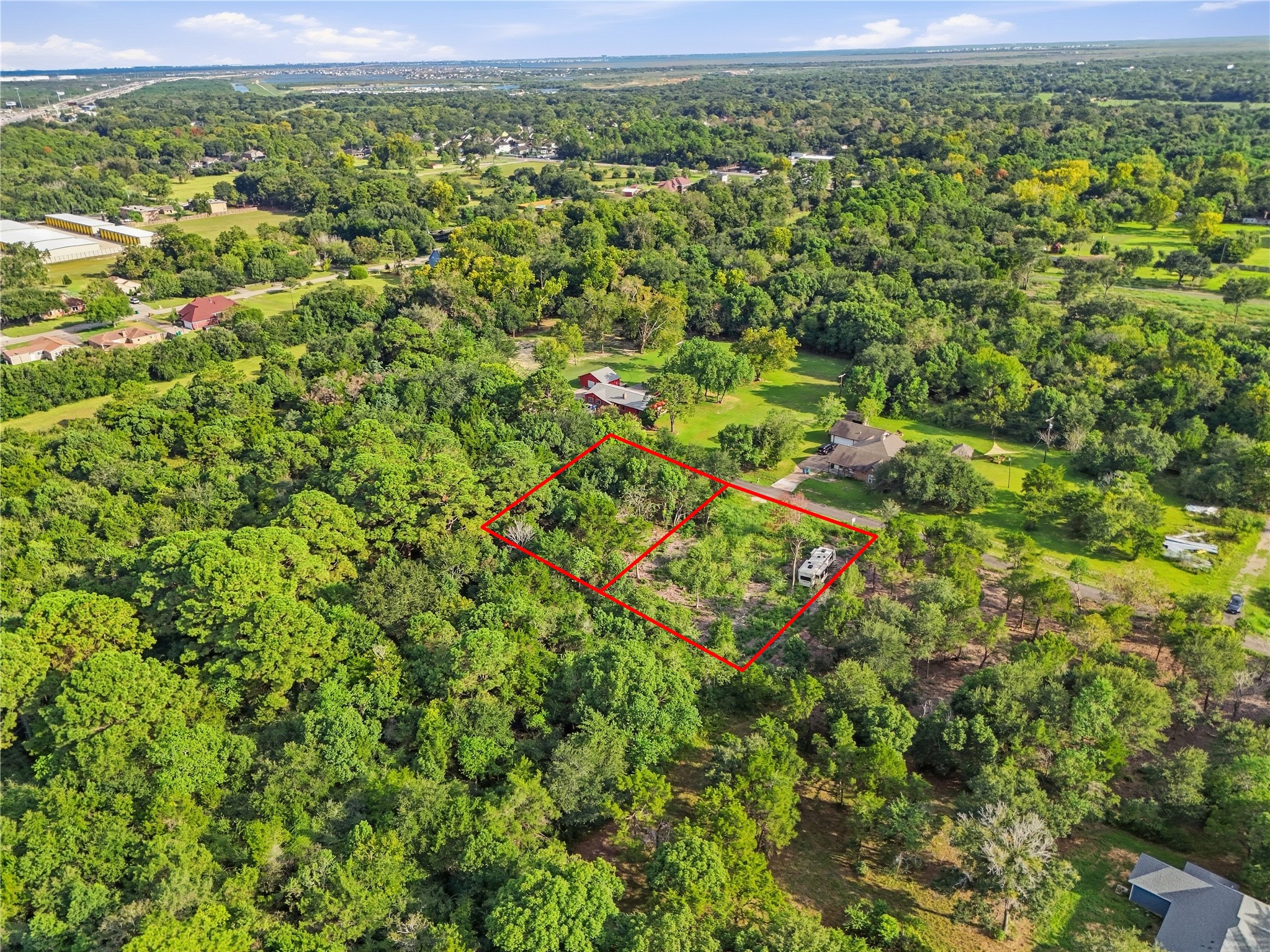 Wooded setting offering privacy with room to create your vision.