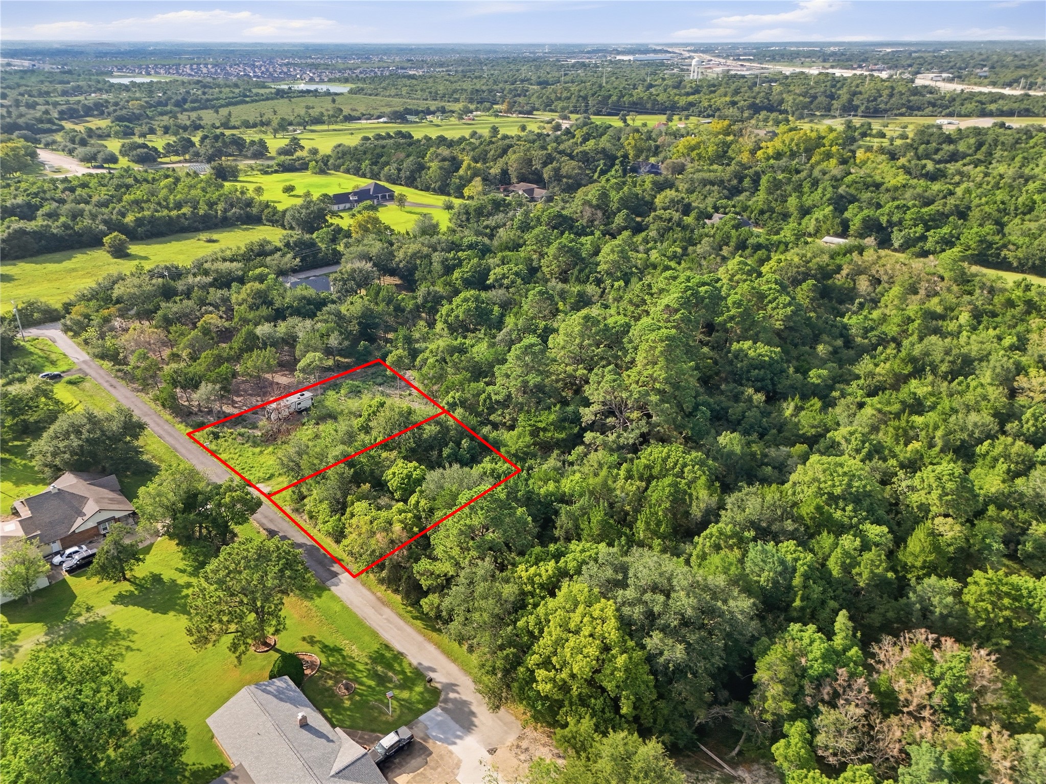 Spacious property with a mix of cleared and wooded areas to work with.