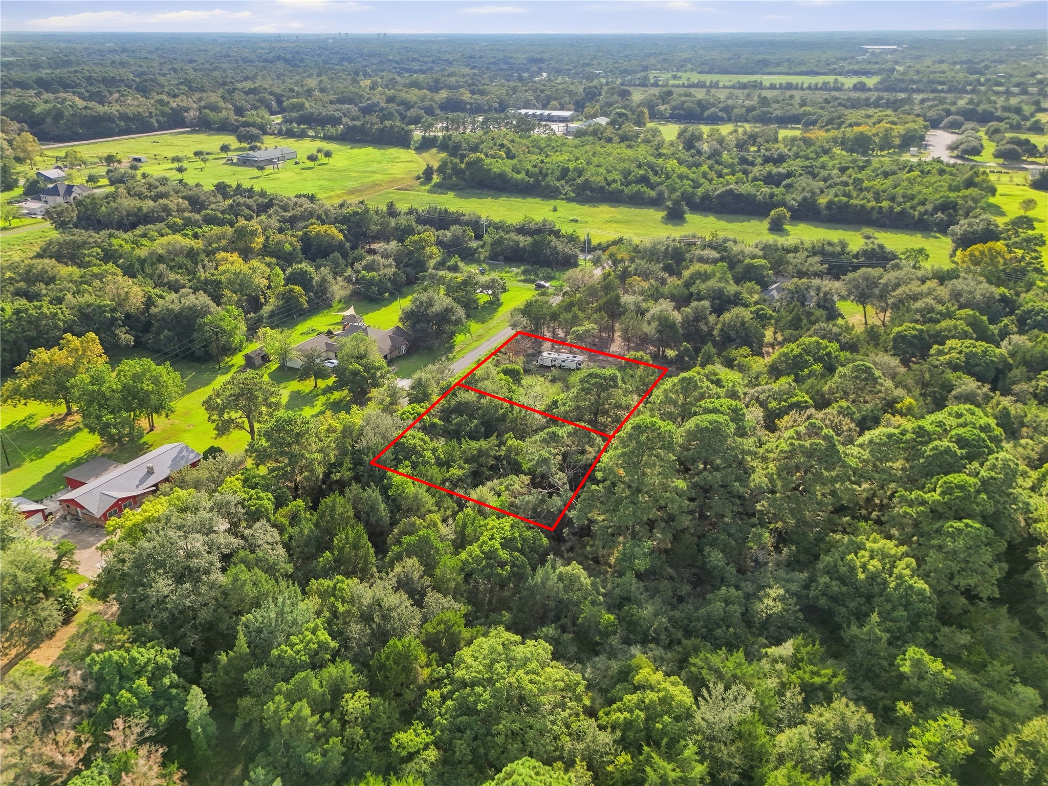 Opportunity to own two neighboring parcels surrounded by mature trees.