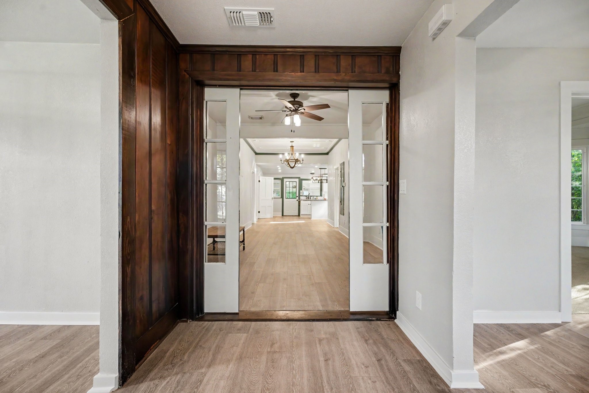 Beautiful front formal foyer with sliding doors