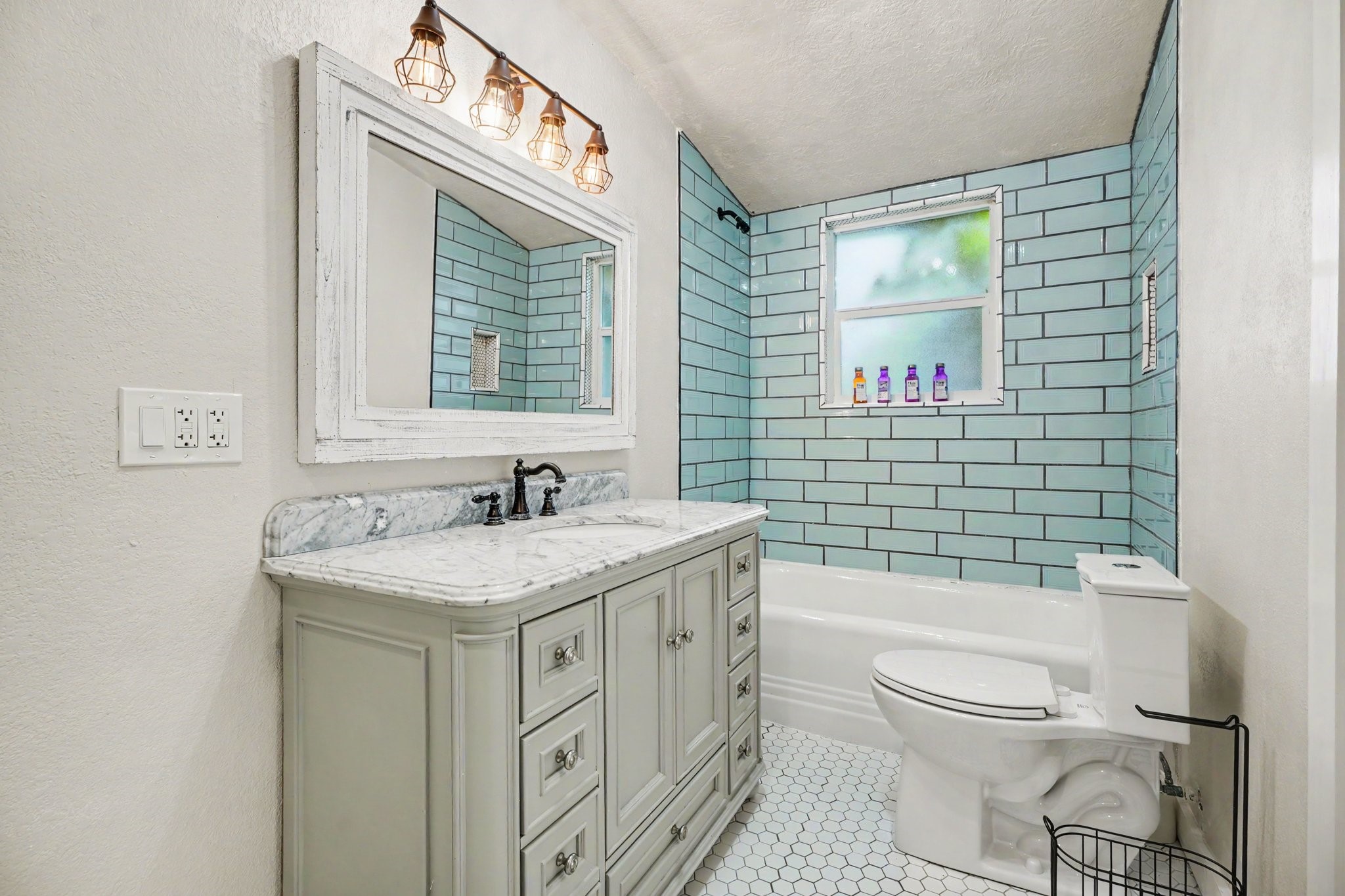 Second full bathroom also fully remodeled beautiful vanity area and tub/shower combo with matching tilework