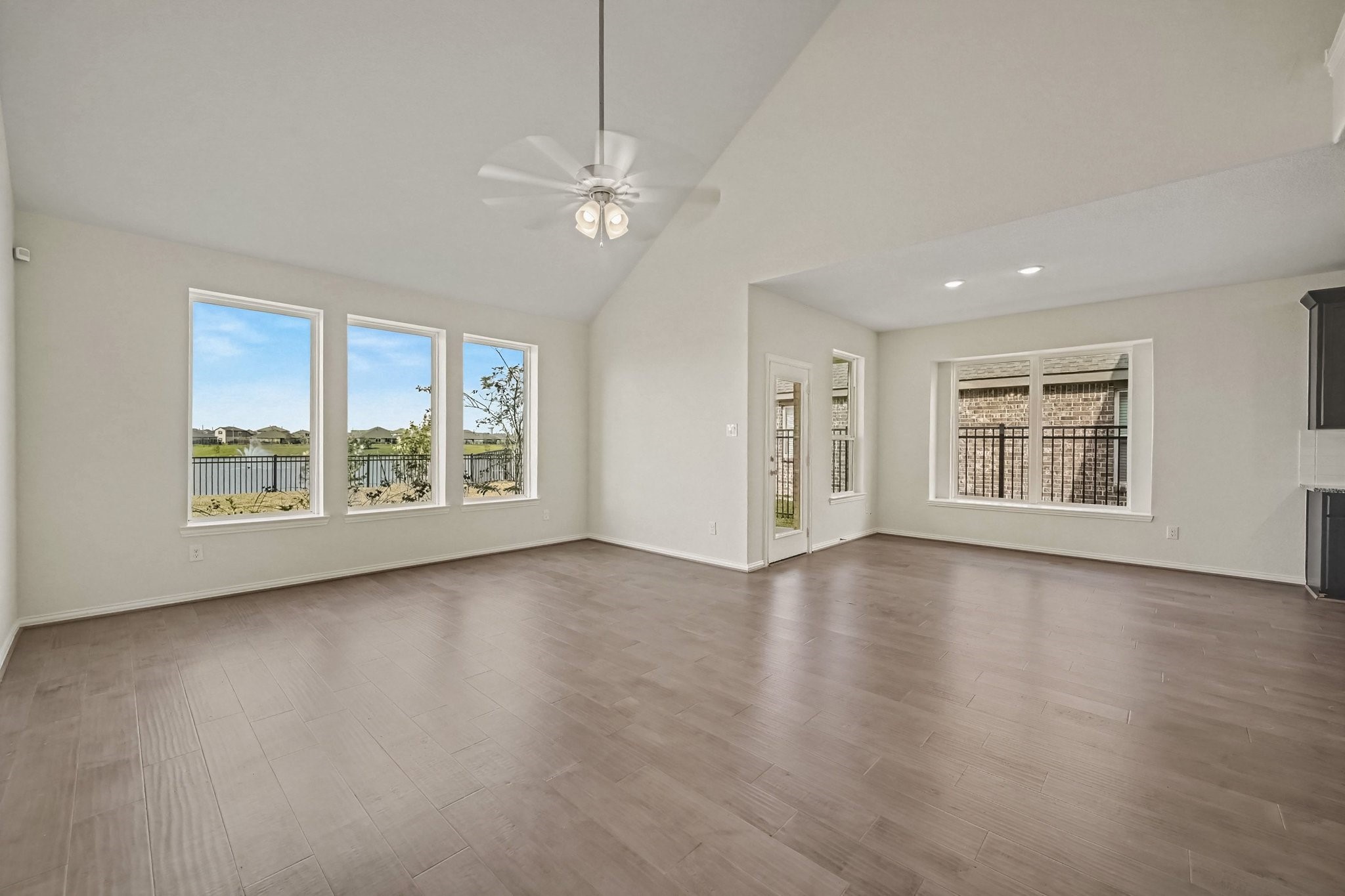 Living room and eat in kitchen overlooking the backyard lake view Living room and eat in kitchen overlooking the backyard lake view