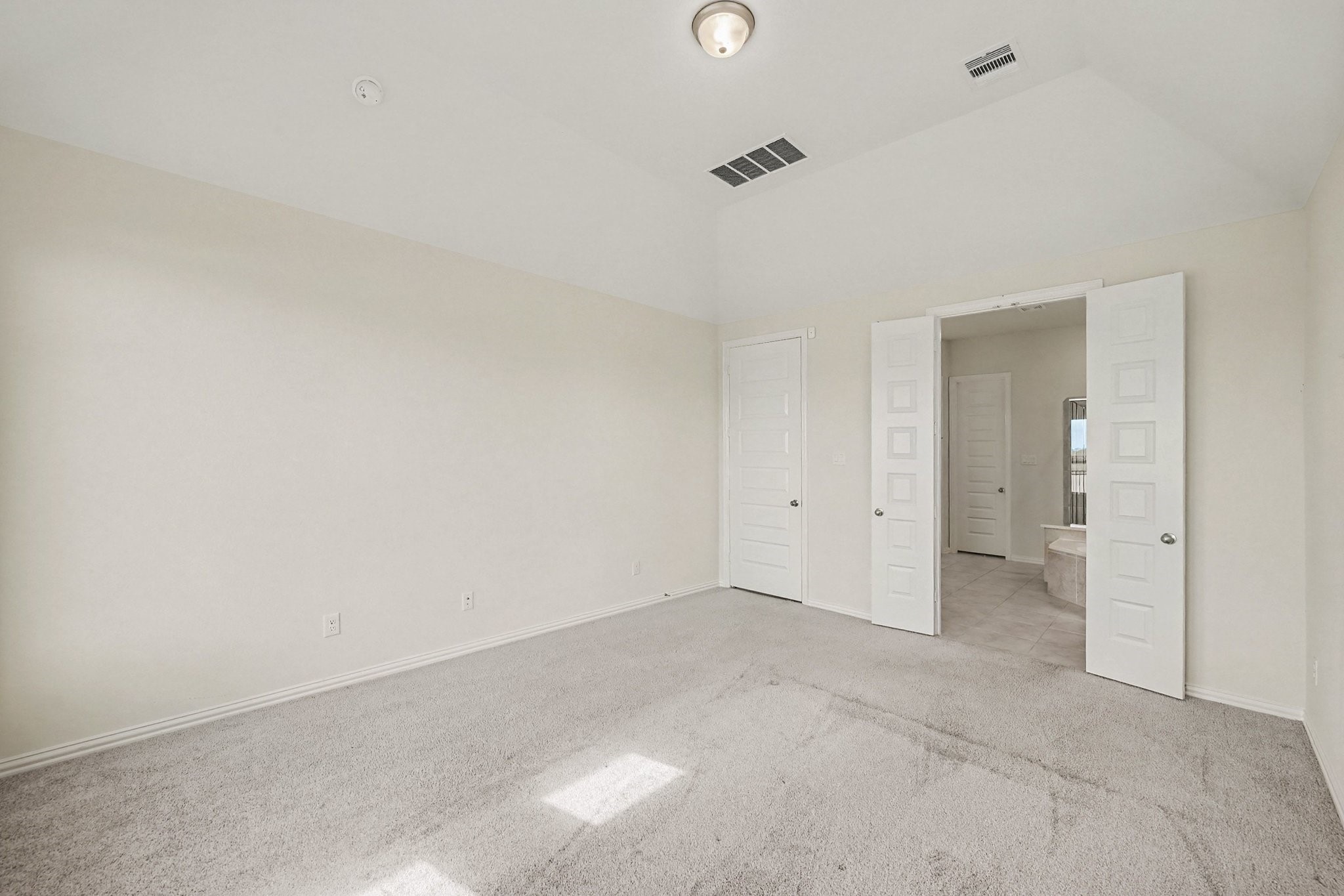 Primary bedroom with tons of natural light Primary bedroom with tons of natural light