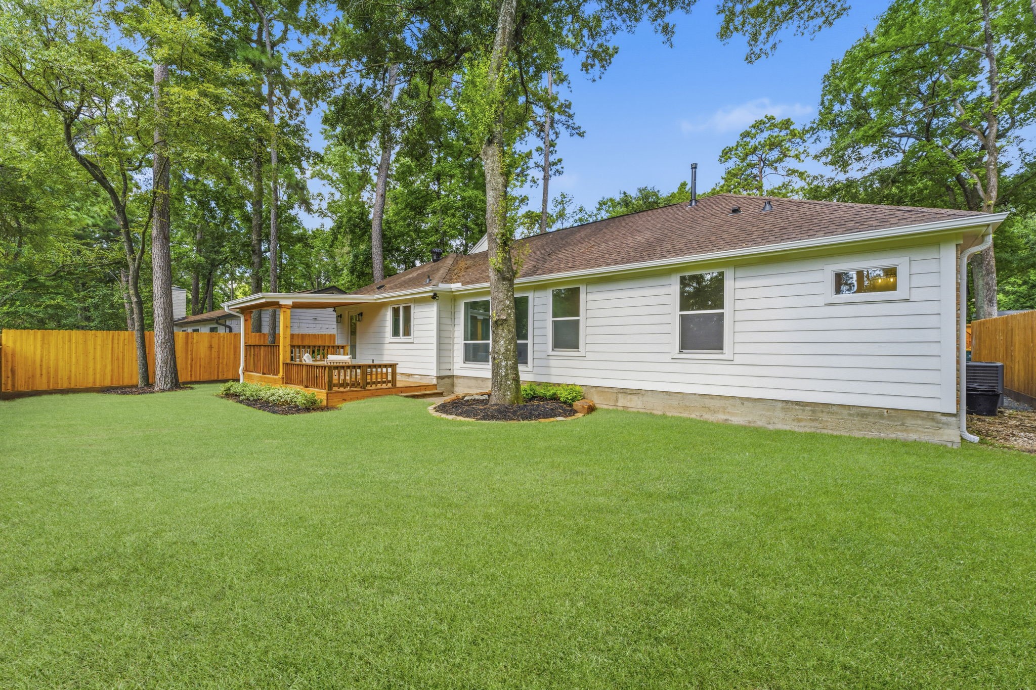 The expansive backyard offers endless possibilities, with plenty of room to add a custom pool, outdoor kitchen, or play area.
