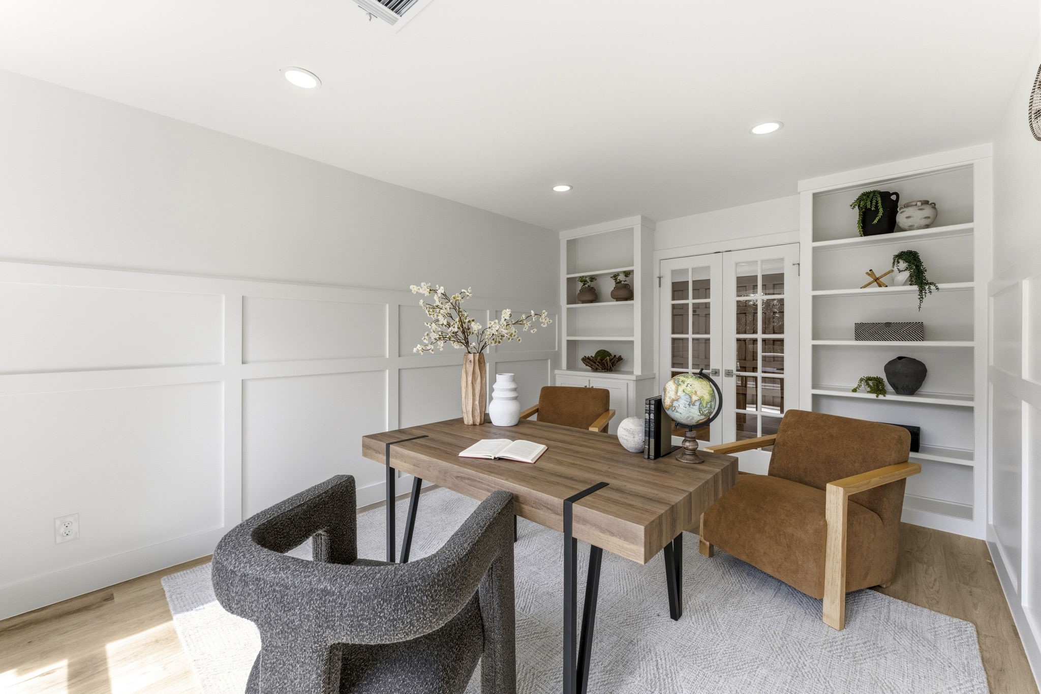 Inviting workspace with custom built in shelving.